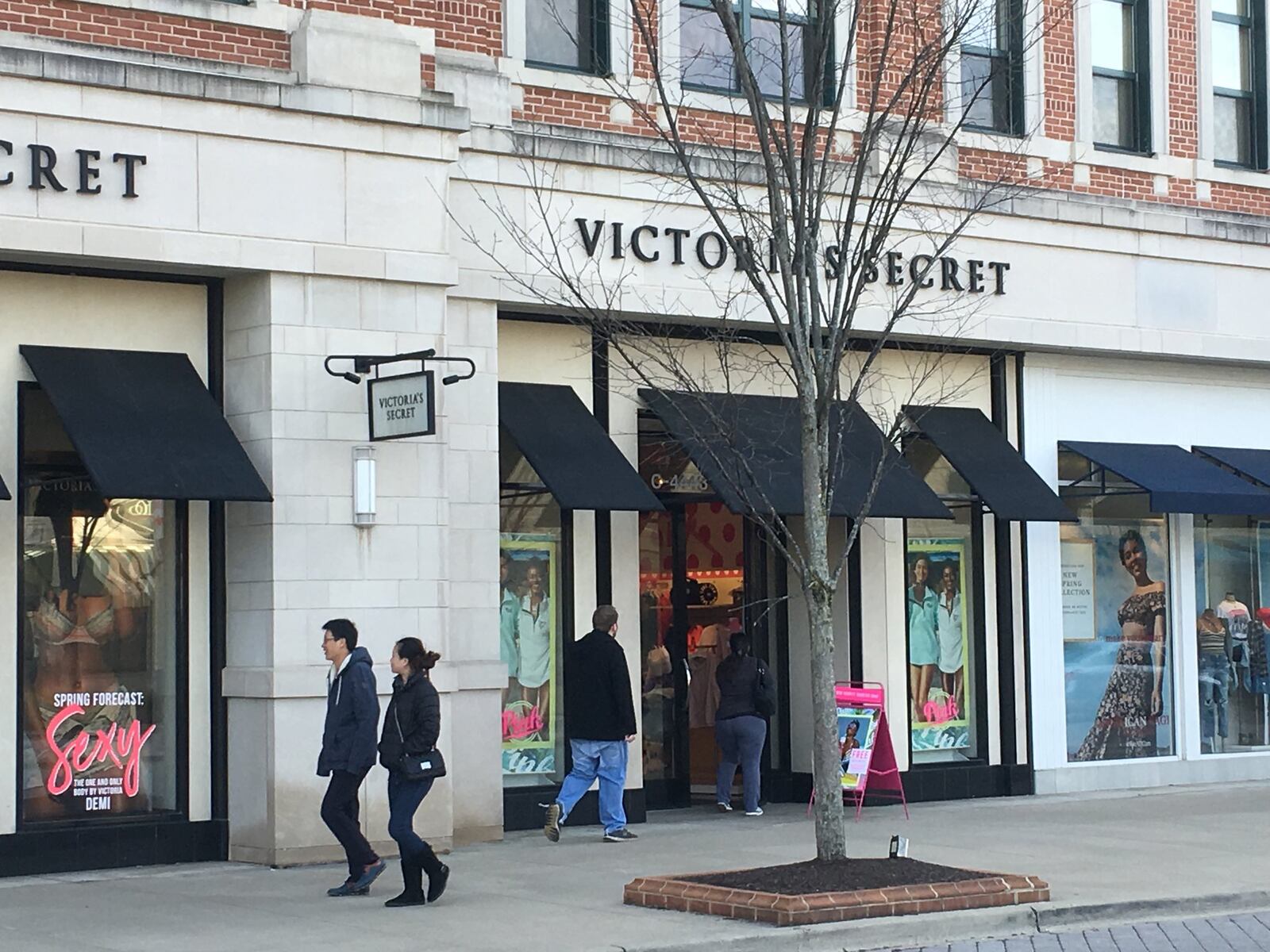 Shoppers went in and out of stores at The Greene Town Center in Beavercreek on Tuesday afternoon. KARA DRISCOLL/STAFF