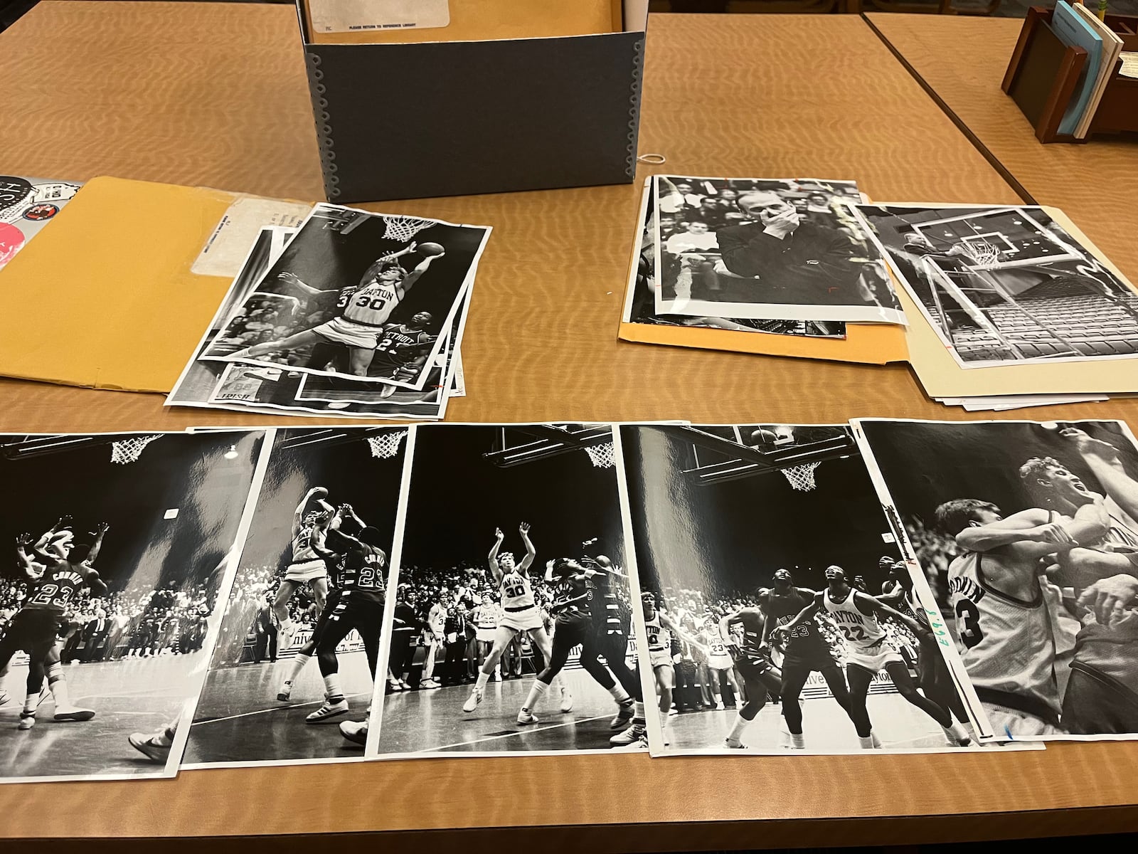 Photos of Ed Young's famous shot against DePaul in 1984. Dayton Daily News photos from Wright State University Special Collections and Archives