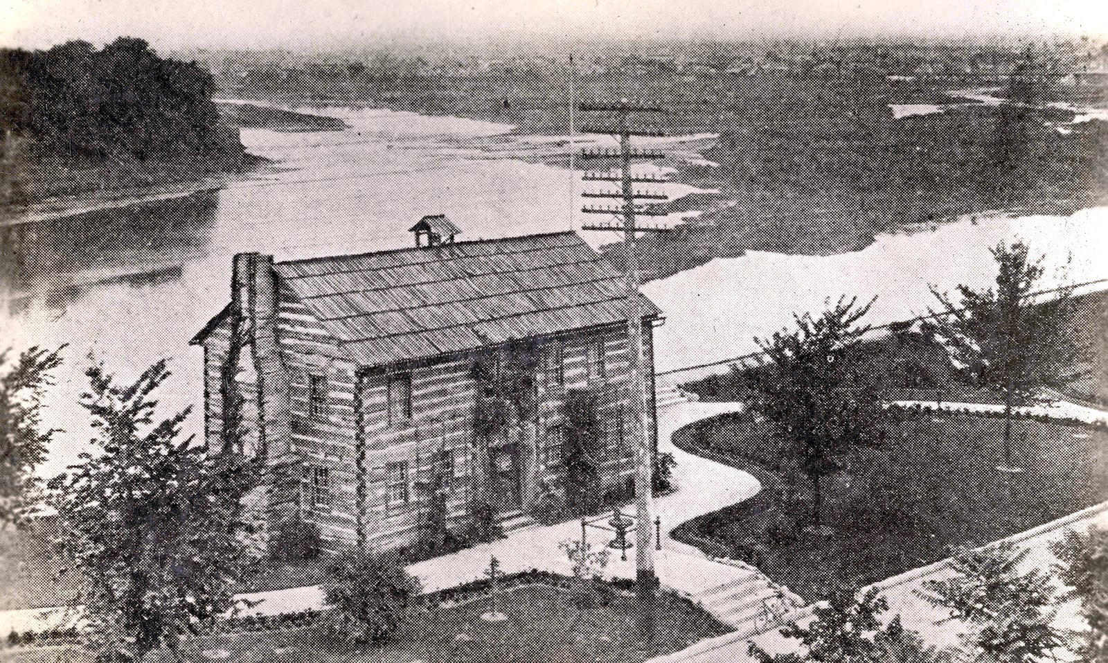 A view of Newcom Tavern at its Van Cleve Park location along the Great Miami River. The structure was moved and restored and converted into a museum. It was the centerpiece of Dayton's 1896 Centennial celebration. DAYTON METRO LIBRARY