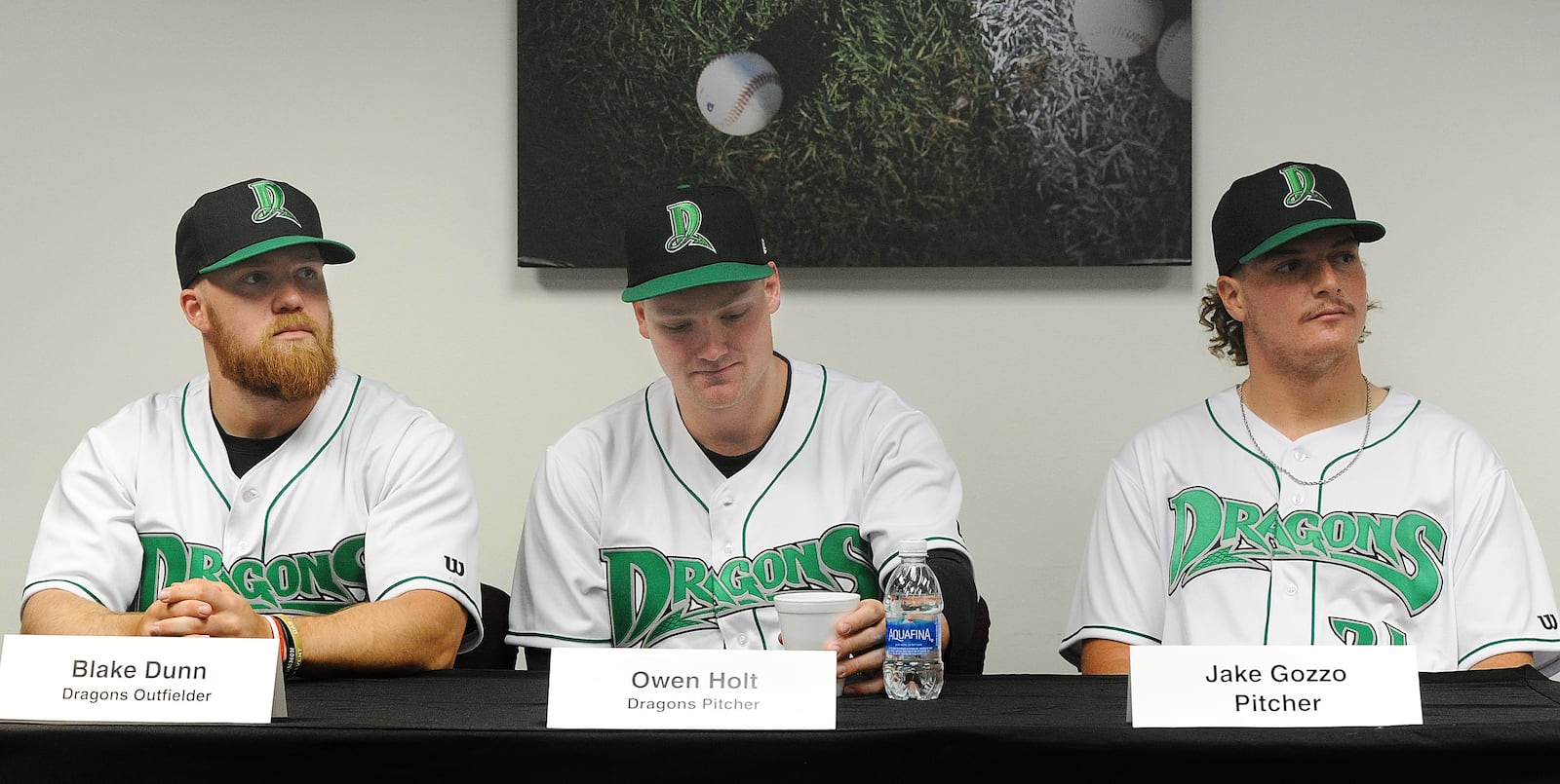 Dayton Dragons players, from left, Blake Dunn, Owen Holt and Jake Gozzo, talks with the Media Monday April 10, 2023 during media day at DayAir Ball Park. MARSHALL GORBY\STAFF 