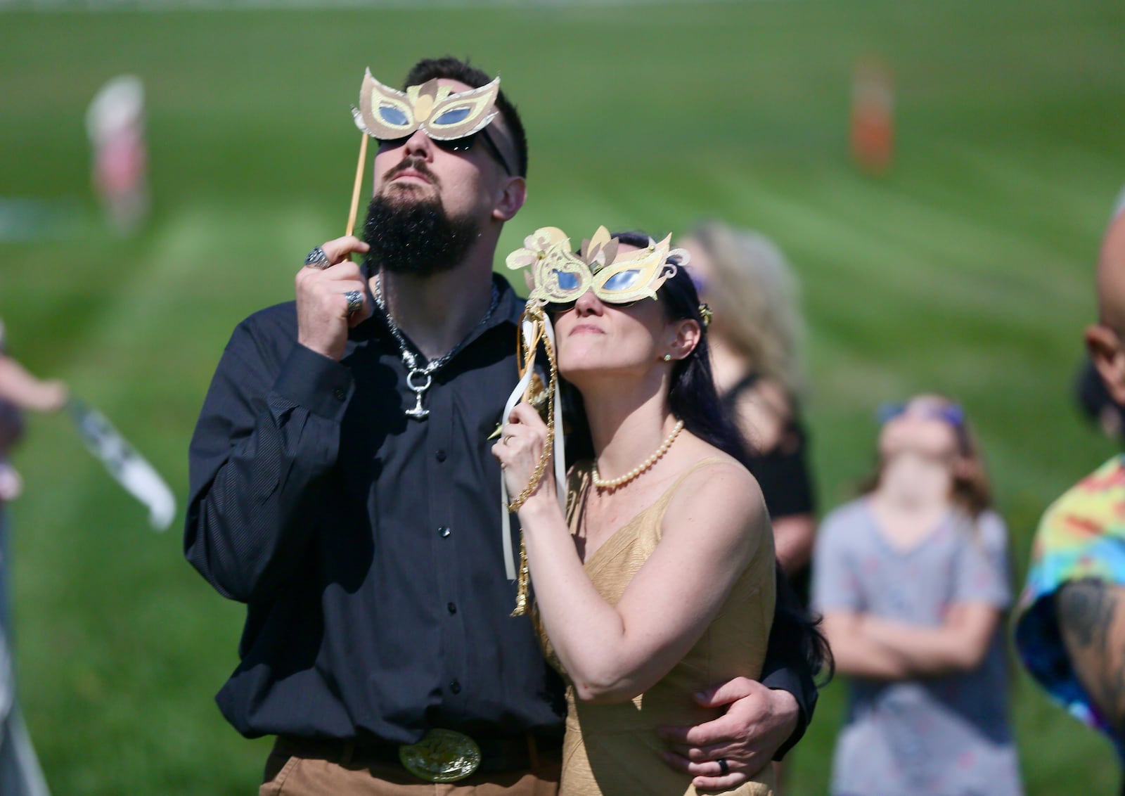 22 couples including Zach Collums and Ashley Jones received or renewed their wedding vows during a ceremony at Trenton Community Park held during the total solar eclipse, Monday, April 8, 2024. GREG LYNCH/STAFF