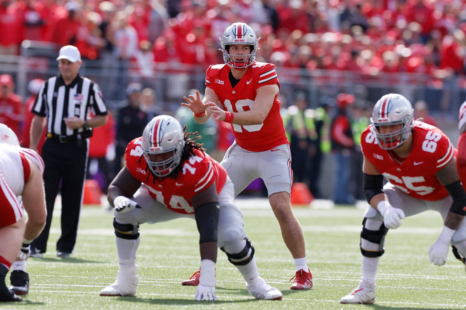 FILE - Ohio State quarterback Will Howard prepares to handle the snap during an NCAA college football game against Nebraska, Saturday, Oct. 26, 2024, in Columbus, Ohio. (AP Photo/Jay LaPrete, File)