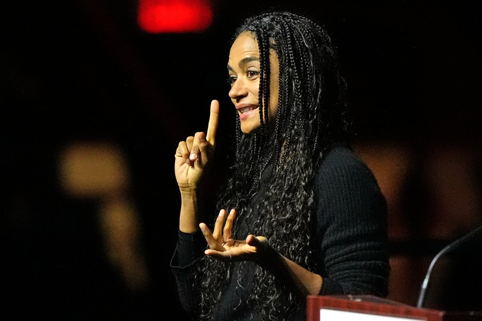 Actress Lauren Ridloff communicates through sign language at a commemoration event to mark the one year anniversary of the mass shooting in Lewiston, Maine, Friday, Oct. 25, 2024. (AP Photo/Robert F. Bukaty)