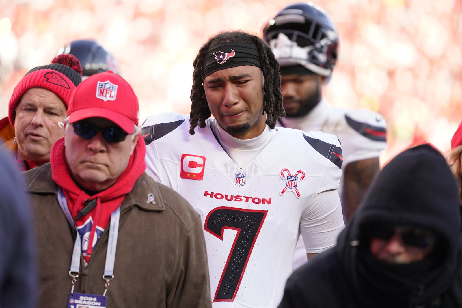 Houston Texans quarterback C.J. Stroud reacts after teammate Tank Dell was injured while catching a touchdown pass during the second half of an NFL football game against the Kansas City Chiefs Saturday, Dec. 21, 2024, in Kansas City, Mo. (AP Photo/Ed Zurga)