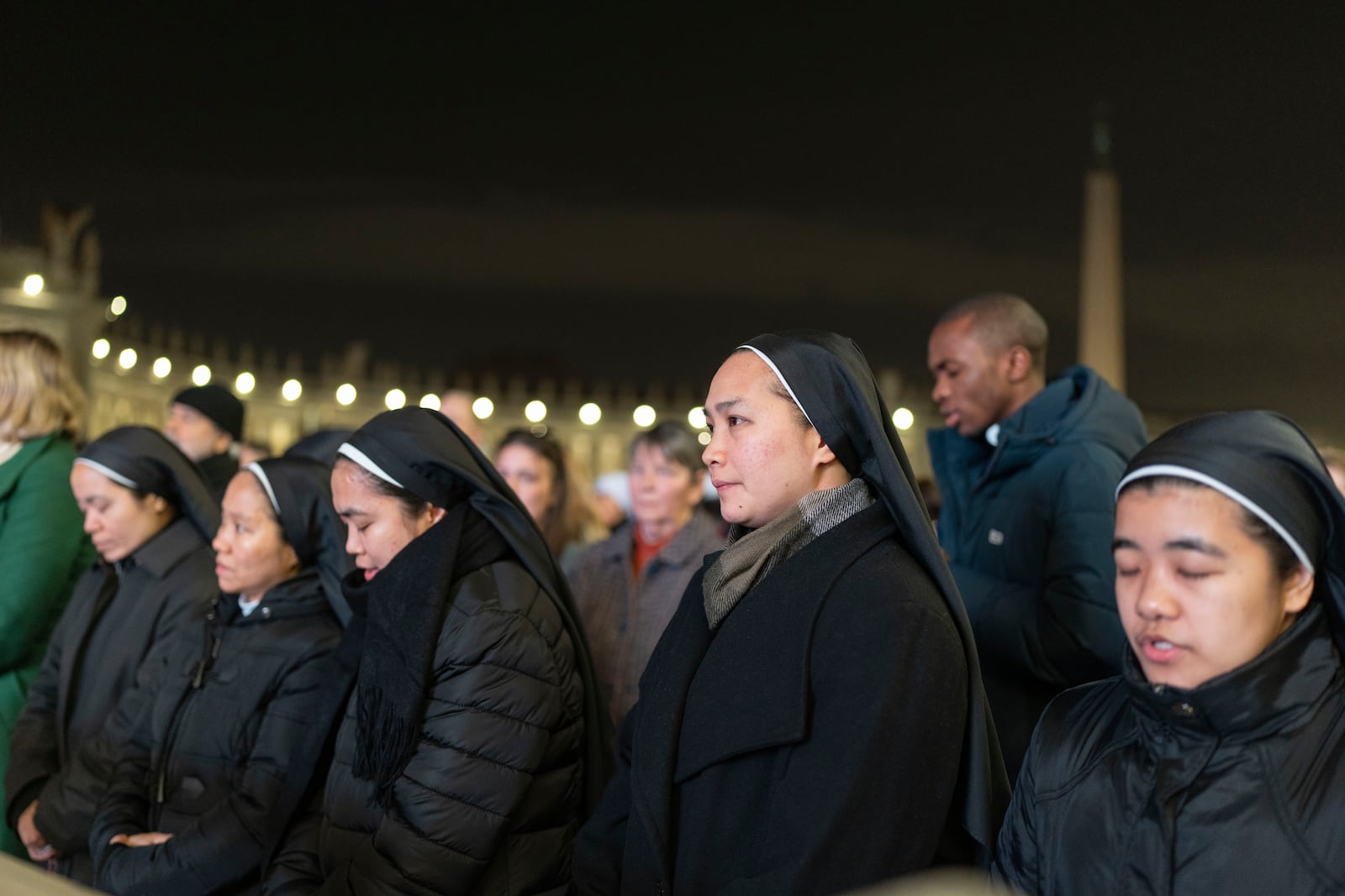 Catholic faithful attend a nightly rosary prayer service for the health of Pope Francis in St. Peter's Square at the Vatican. (AP Photo/Mosa'ab Elshamy)