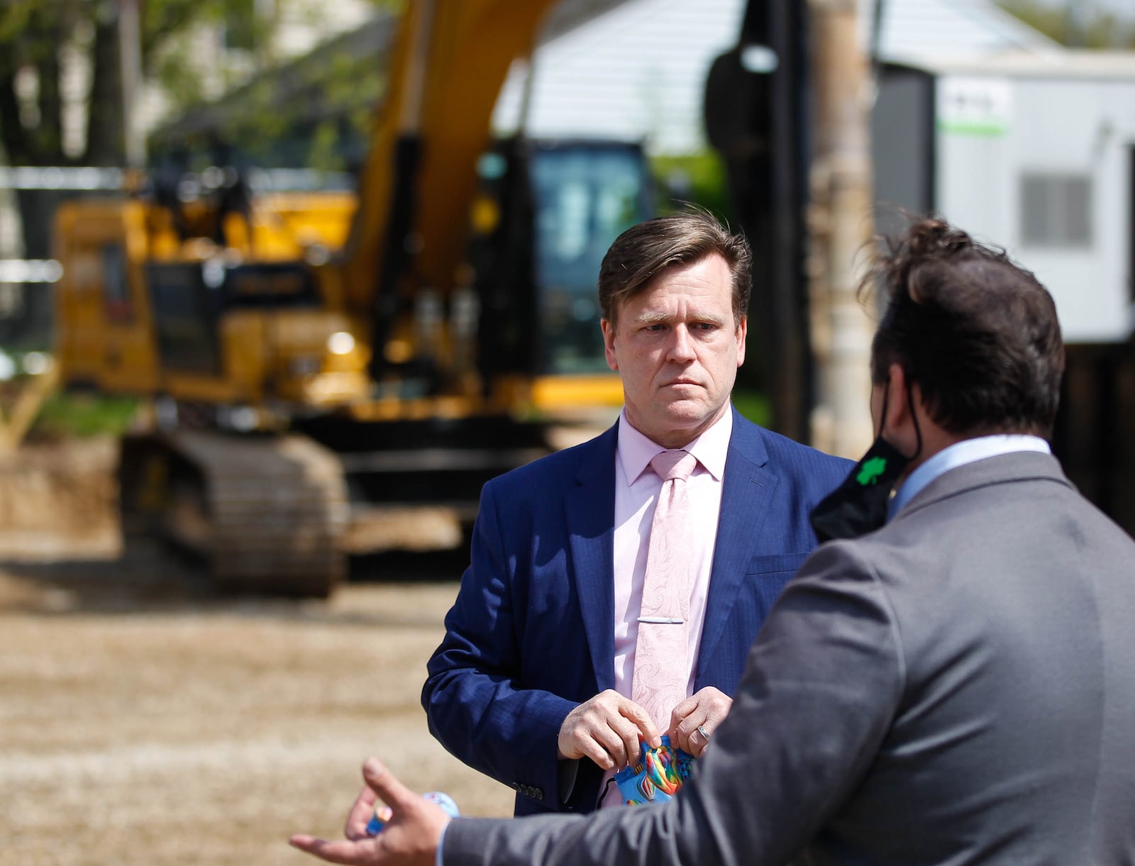 Jeffrey Trzeciak, left, Dayton Metro Library's new executive director, speaks with Riverside Mayor Peter Williams at a groundbreaking for the new Burkhardt Branch Library. CHRIS STEWART / STAFF