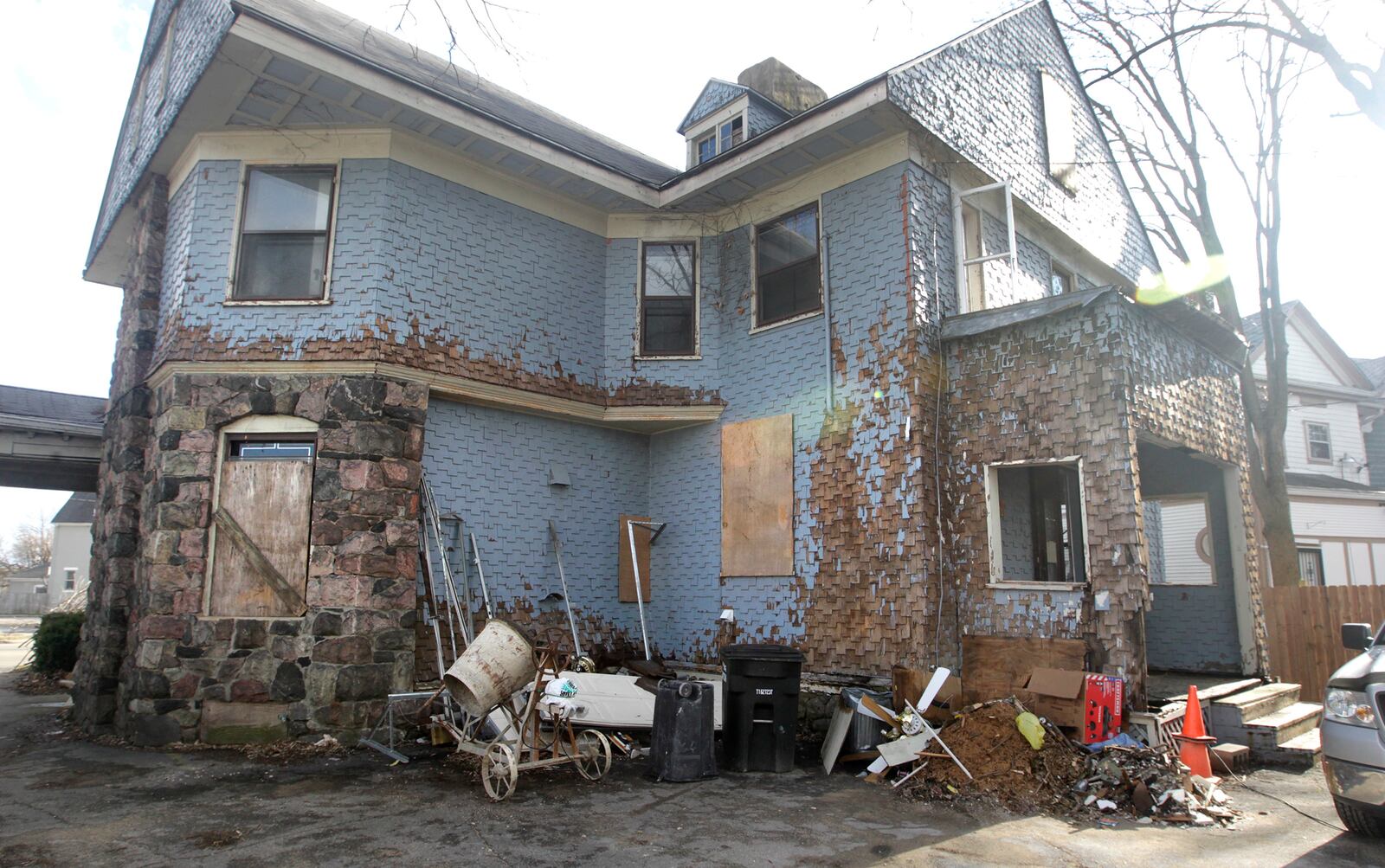 Chris Lewis is rehabbing a historic house in the Dayton View Historic District that once belonged to Gov. James M. Cox. Lewis was selected in August of last year from more than a dozen applicants to receive the home for free from the owner. The Dayton Society of Interior Designers is providing volunteer help with the home with plans to hold a community open house in late fall. LISA POWELL / STAFF