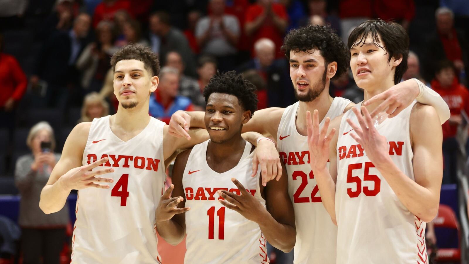 Dayton's Koby Brea, Malachi Smith, Mustapha Amzil and Mike Sharavjamts pose for a photo against La Salle on Tuesday, Feb. 28, 2023, at UD Arena. David Jablonski/Staff