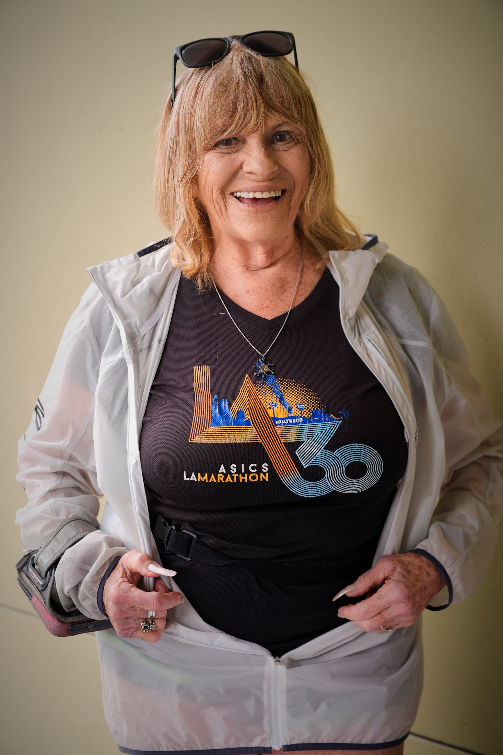 Sharon Kerson, 83, poses for a photo while training at the West Los Angeles College track in Culver City, Calif., Thursday, March 13, 2025. (AP Photo/Damian Dovarganes)