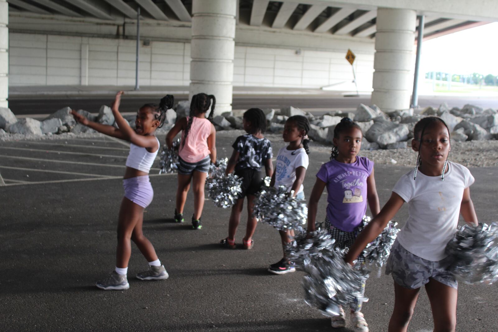 Members of the Western Stars Drill Team & Drum Line practice at a parking lot in downtown Dayton. CORNELIUS FROLIK / STAFF