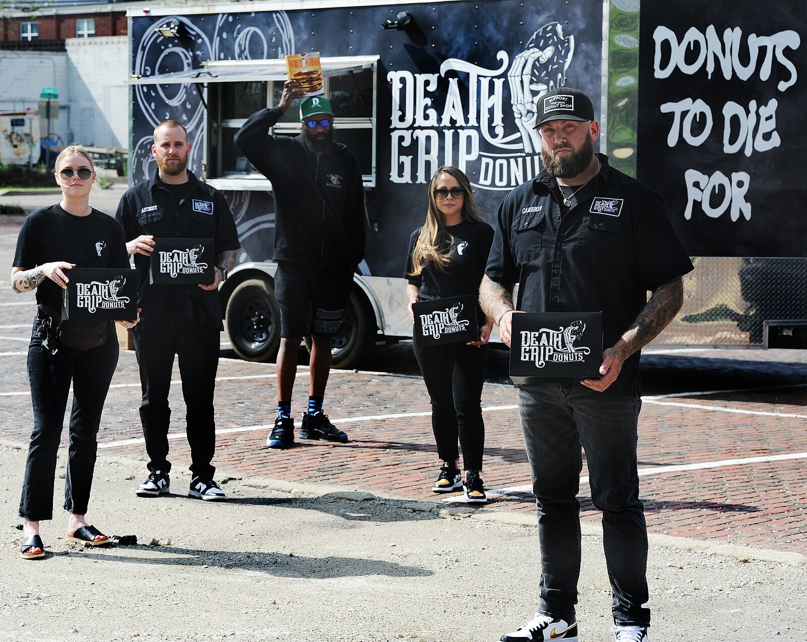 Death Grip Donuts is collaborating with Uncle Boof’s World Famous Pancake Mix for a “Locals Only” donut featuring a traditional vanilla donut with maple glaze, three mini pancakes and a dollop of cinnamon butter that’s served with a pipette of maple syrup. Pictured left to right is Kylie Bauer, Anthony Brewer, Dexter Clay, Lainey Lucas and Cameron Hill. MARSHALL GORBY\STAFF