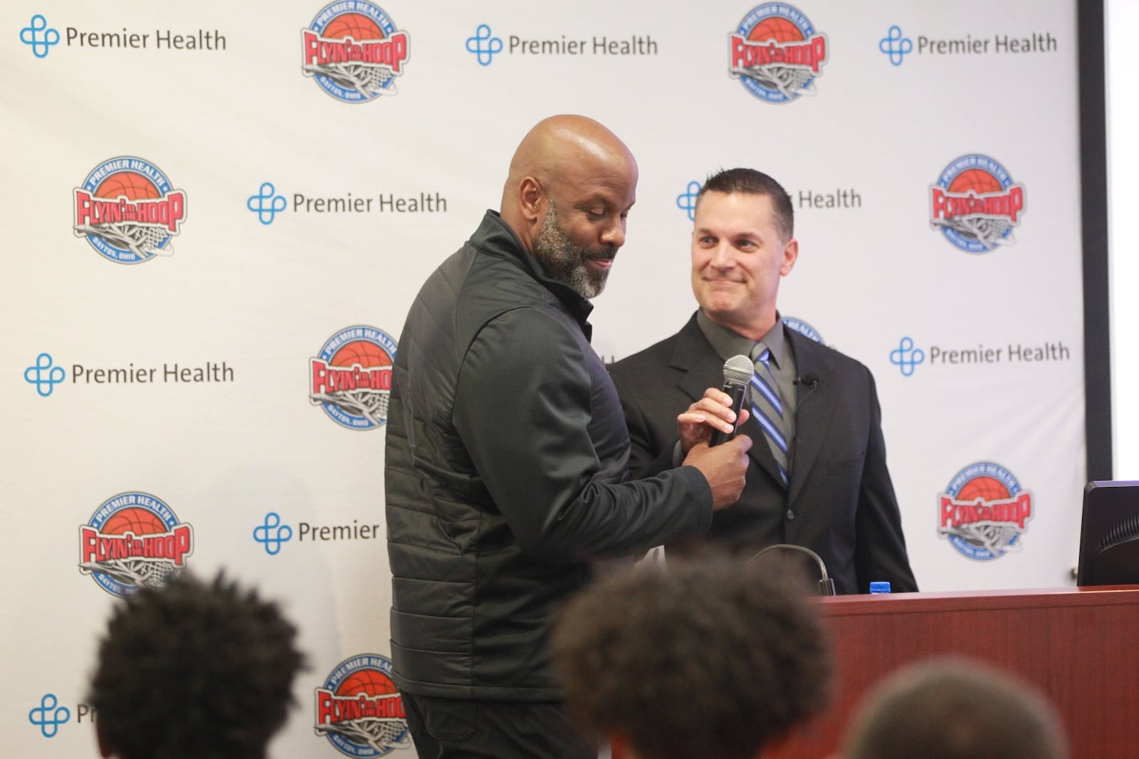 Premier Health Flyin’ to the Hoop creator Eric Horstman (right) introduces Thurgood Marshall coach Shawn McCullough during a press conference at Miami Valley Hospital South in Centerville on Tuesday, Oct. 8, 2019. MARC PENDLETON / STAFF