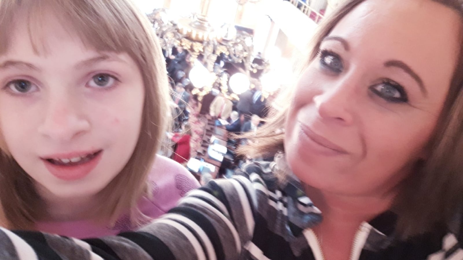 Randi and Destiny take a picture while at the Ohio Statehouse in Columbus Wednesday.