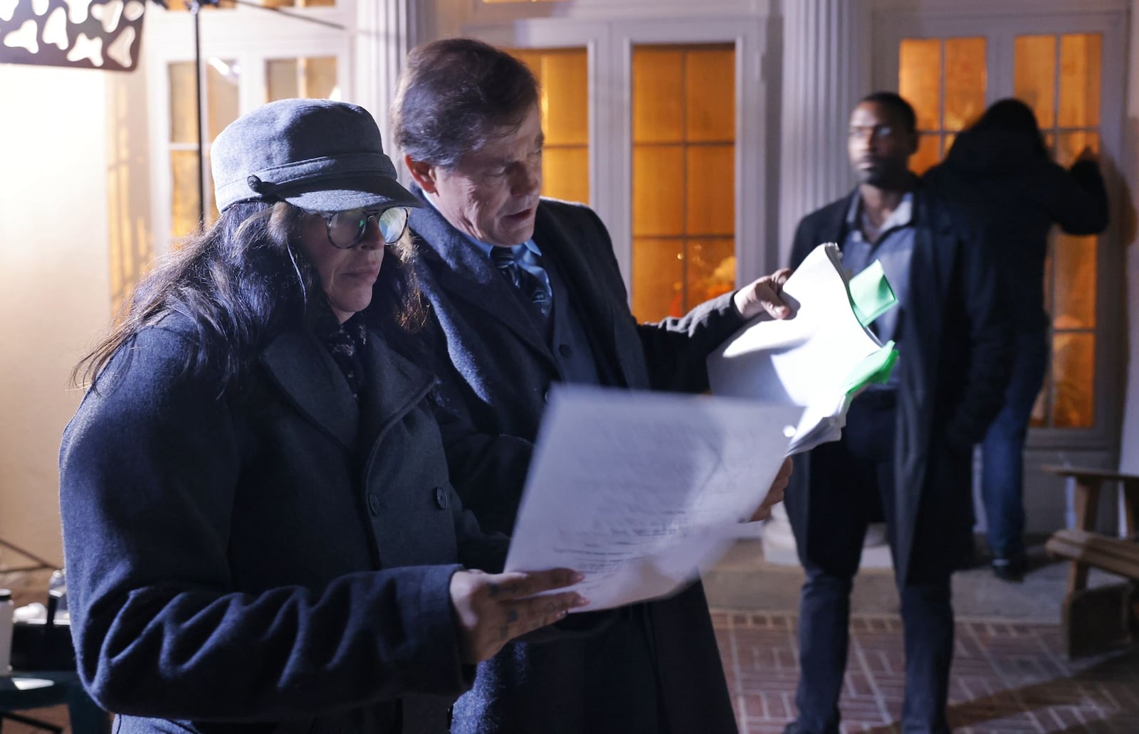 Director Lana Read goes over a scene with Michael Paré with Wendell Kinney in the background during filming of Read's new film, "Death for Dinner", at the historic home of Helen and Rick Stevens-Gleason in early morning hours Saturday, March 16, 2024 in Middletown. NICK GRAHAM/STAFF