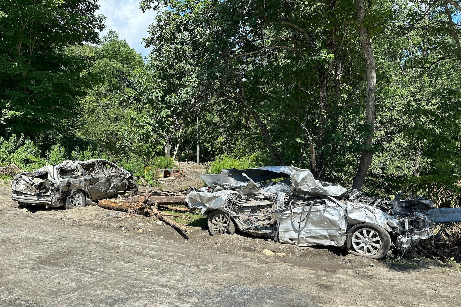 The Mackenzie family's flooded-destroyed cars are shown in Peacham, Vt. on July 18, 2024. (AP Photo/Lisa Rathke)