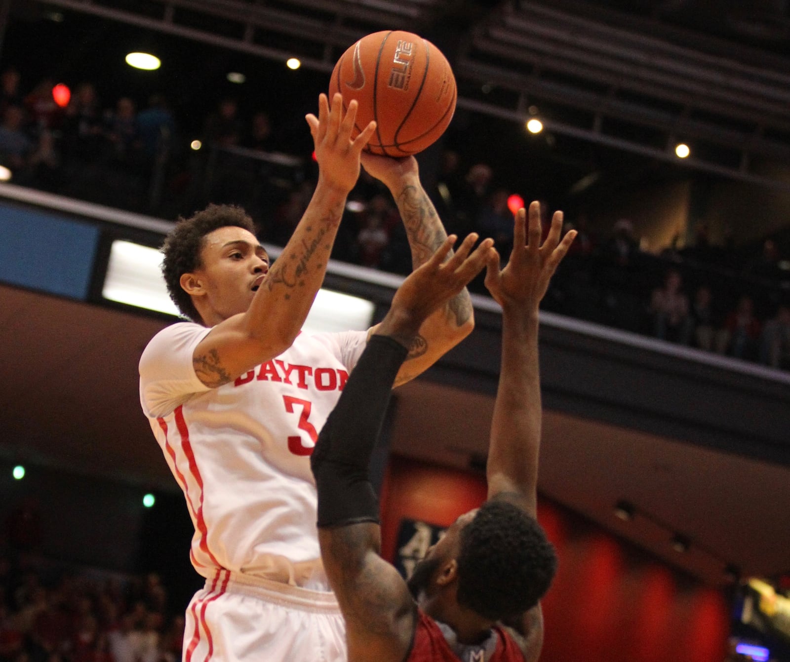 Dayton’s Kyle Davis hits the game-winning shot with 2.1 seconds left against Miami. David Jablonski/Staff