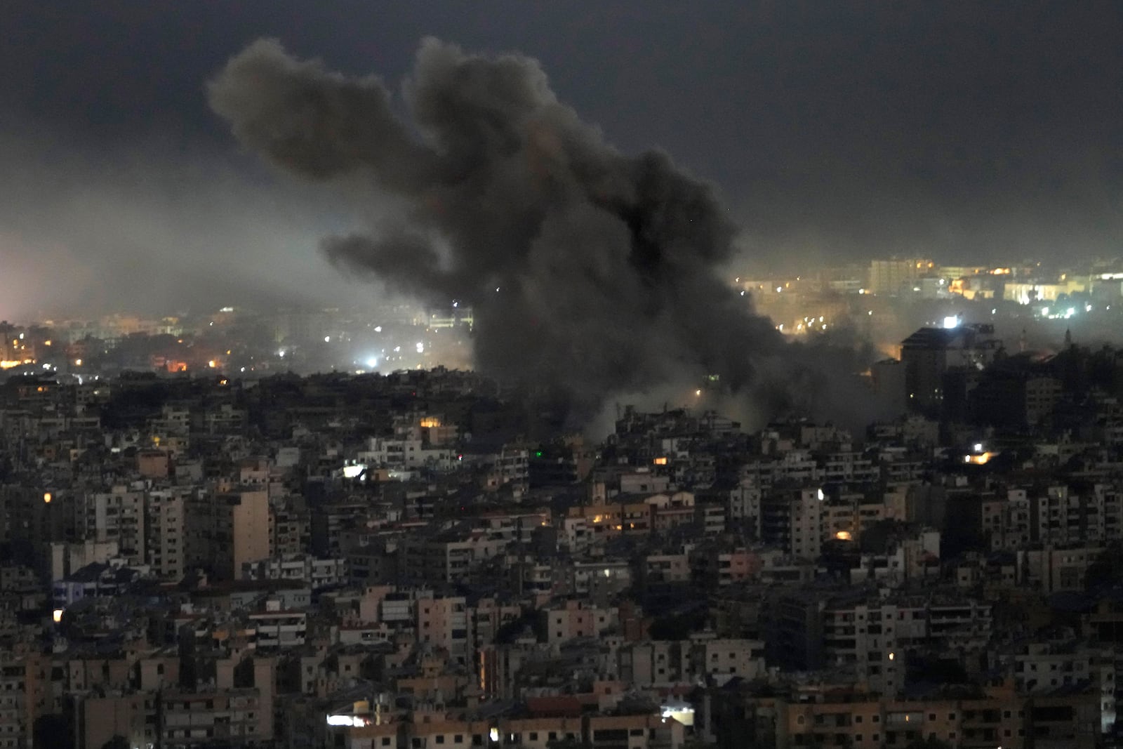 Smoke rises from an Israeli airstrike on Dahiyeh, in the southern suburb of Beirut, Lebanon, Sunday, Oct. 20, 2024. (AP Photo/Hussein Malla)