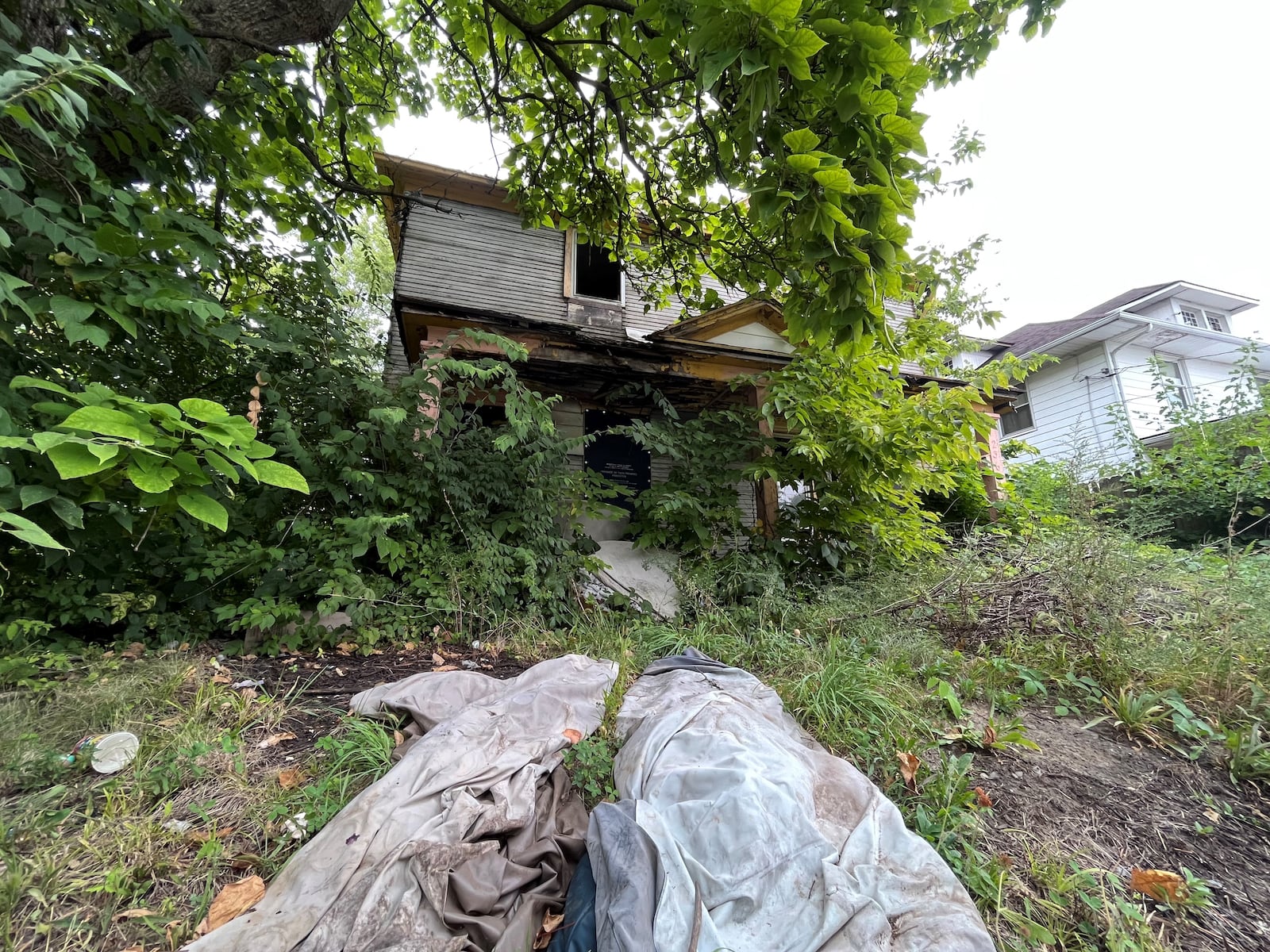 A fire-damaged home in West Dayton that is slated for demolition. CORNELIUS FROLIK / STAFF