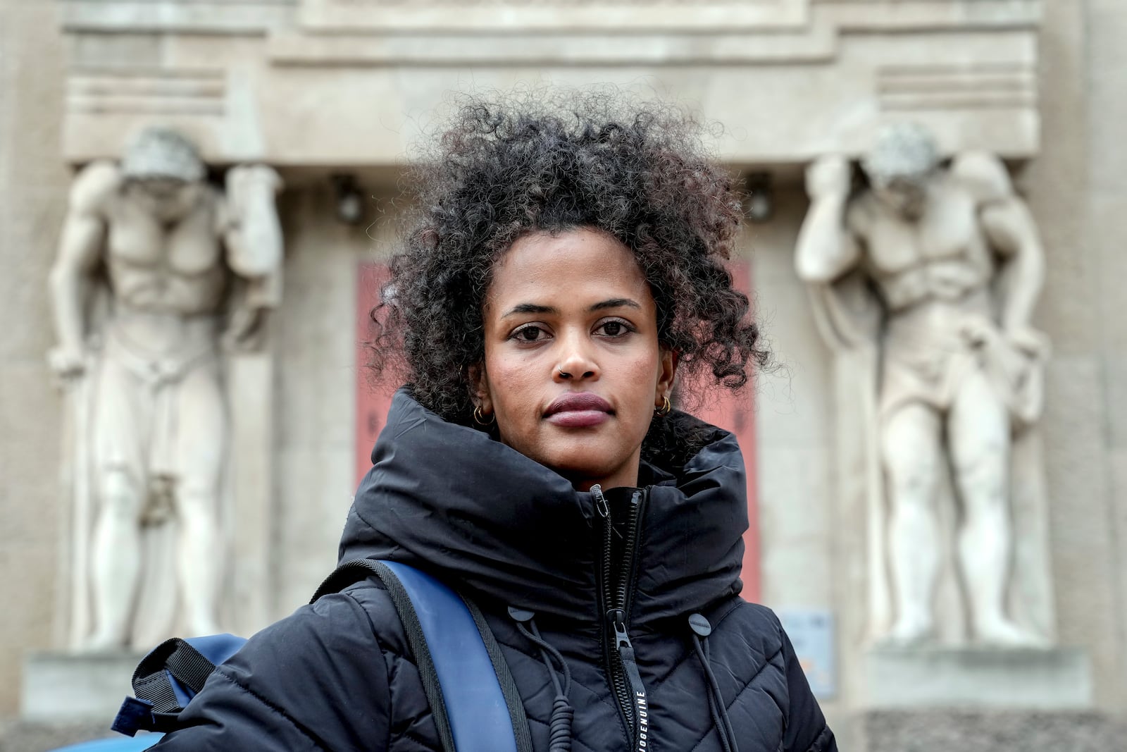 Haben, 26 years old Eritrean immigrant who has lived and worked in Magdeburg for 7 years, poses for a photo in a street, in Magdeburg, Germany, Friday, Feb. 7, 2025. (AP Photo/Ebrahim Noroozi)