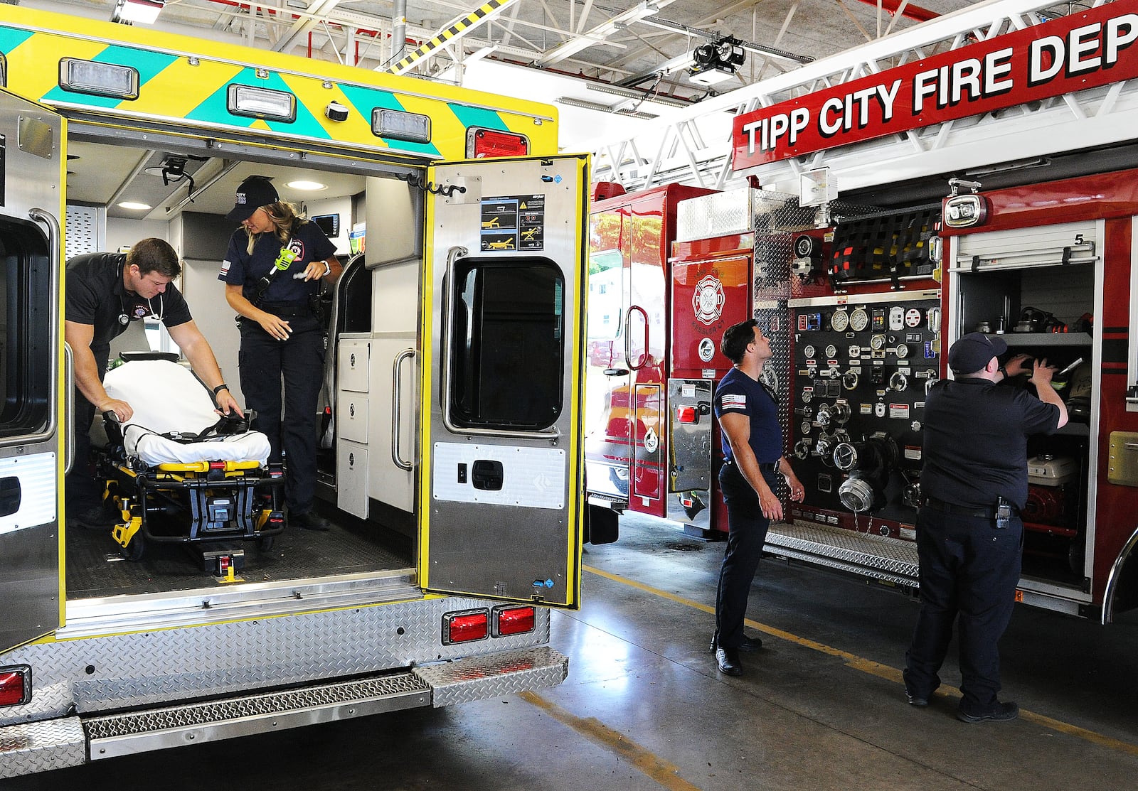 Members of the Tipp City Fire Department check their equipment and gear Thursday July 22, 2022. MARSHALL GORBY\STAFF