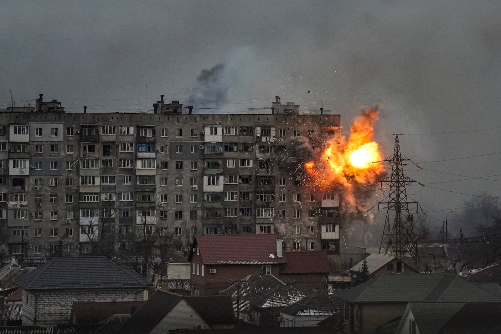 FILE - An explosion erupts from an apartment building at 110 Mytropolytska Street, after a Russian army tank fired on it in Mariupol, Ukraine, March 11, 2022. The image was part of a series of images by Associated Press photographers that was awarded the 2023 Pulitzer Prize for Breaking News Photography. (AP Photo/Evgeniy Maloletka)