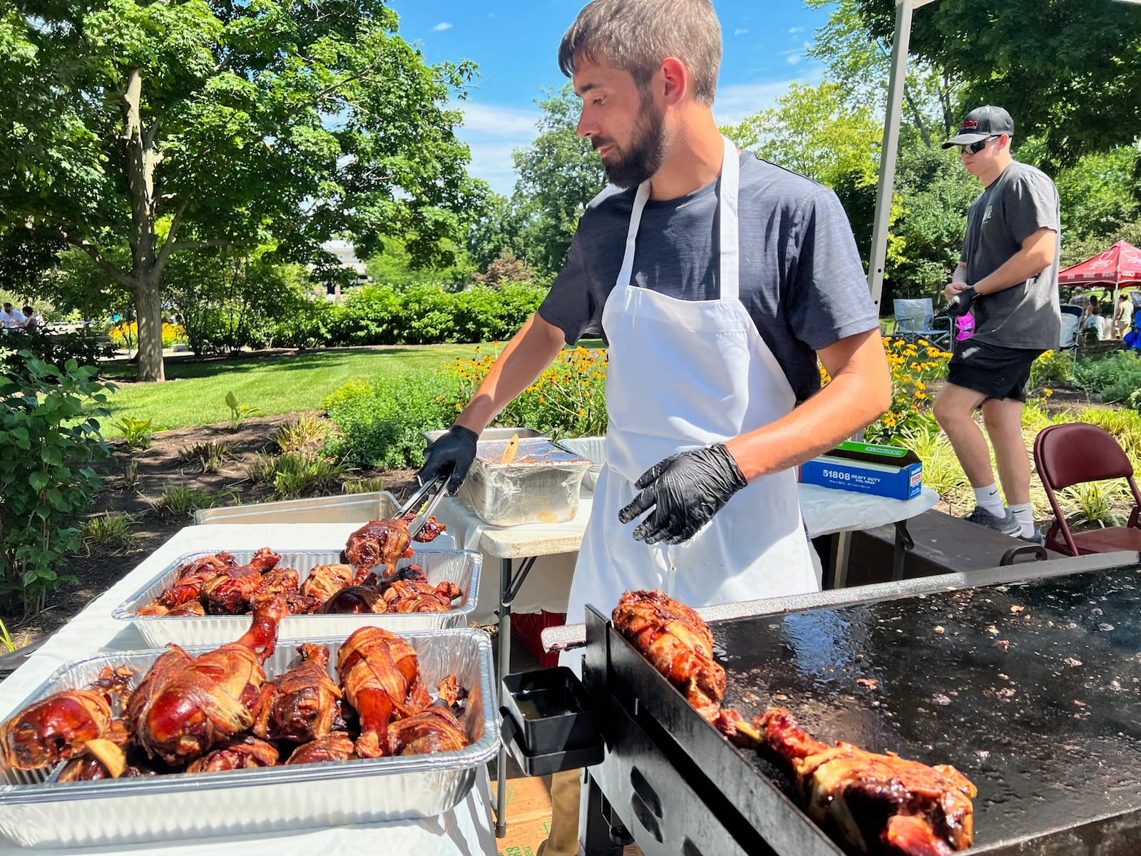 Grilled turkey legs wrapped in bacon were a favorite from Amber Rose Restaurant and Catering at Bacon Fest 2022. ALEXIS LARSEN/CONTRIBUTED