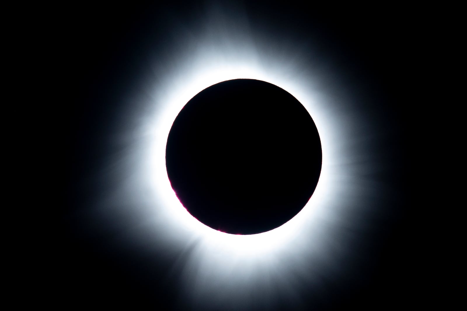 This is a sequence of the total solar eclipse photographed from Marcum Park Monday, April 8, 2024 in Hamilton. NICK GRAHAM/STAFF