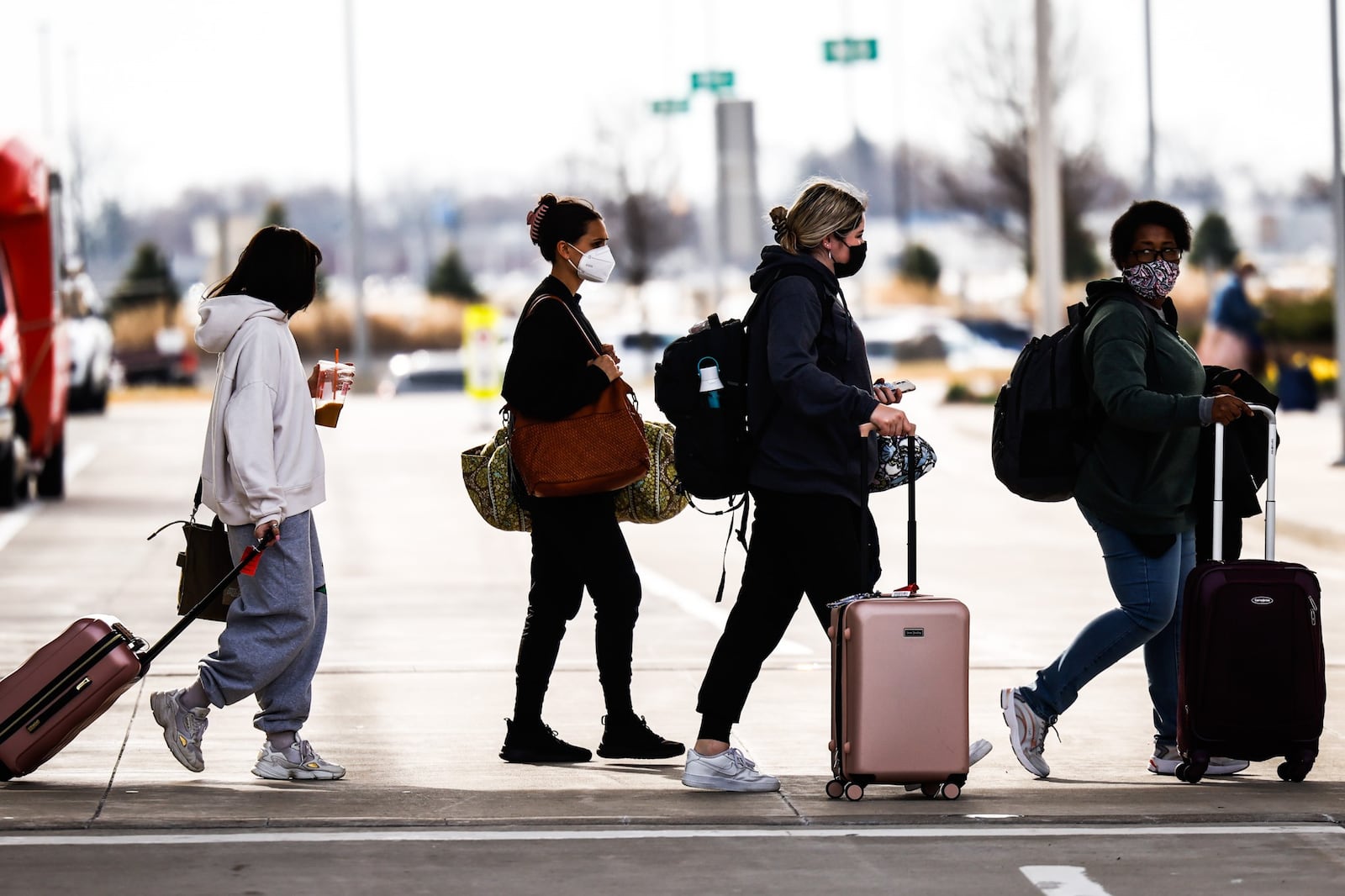 After deplaning at Dayton International Airport, travelers head to their destination Friday March 18, 2022. JIM NOELKER/STAFF