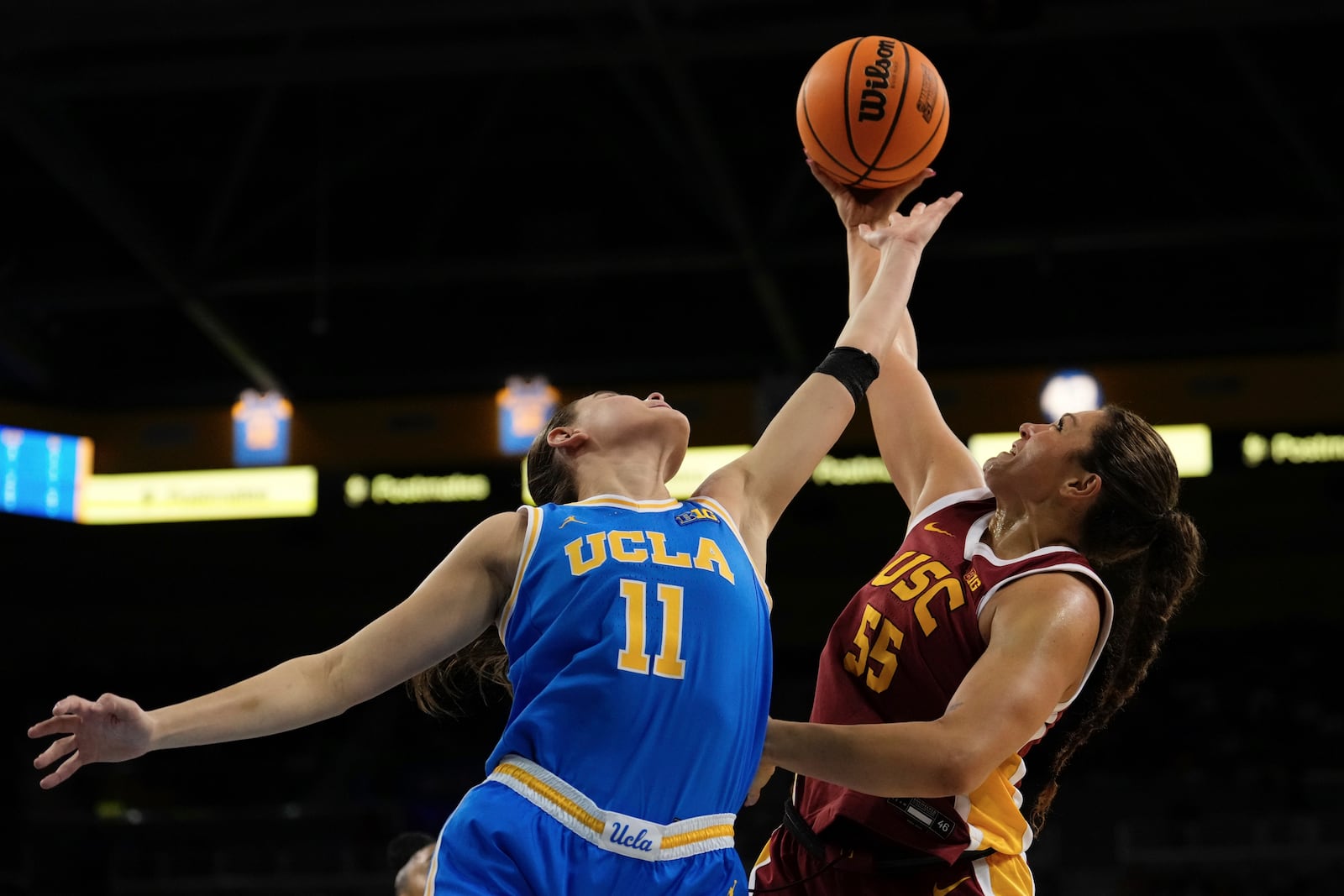 UCLA guard Gabriela Jaquez, left, and Southern California guard Talia von Oelhoffen reach for a rebound during the first half of an NCAA college basketball game Saturday, March 1, 2025, in Los Angeles. (AP Photo/Mark J. Terrill)