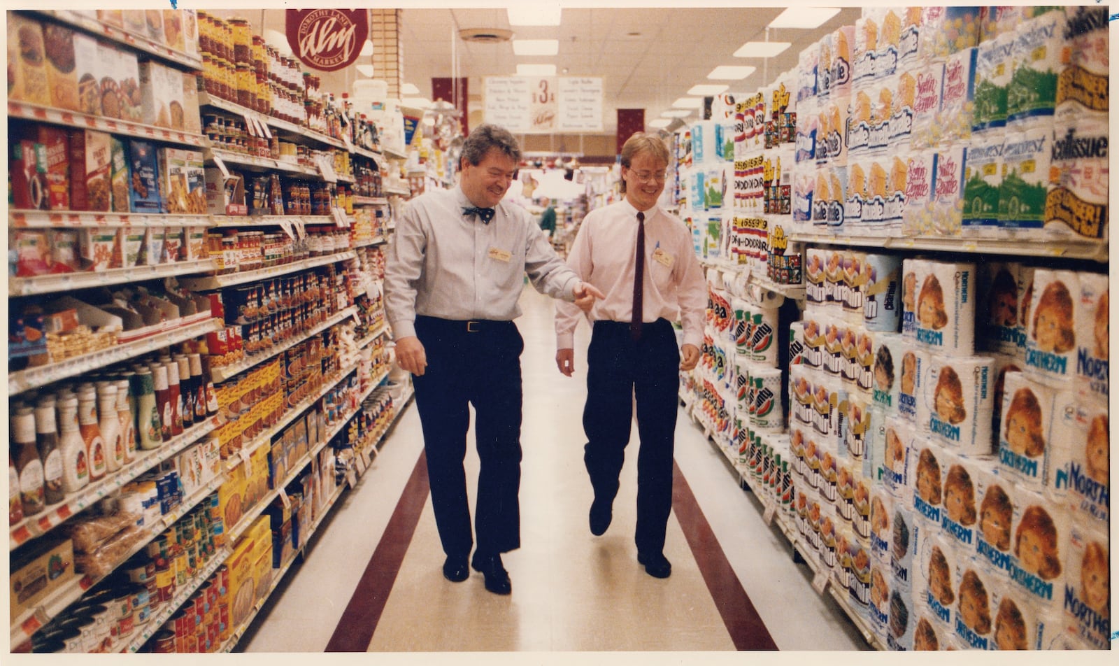 4/30/1992: L to R: Norman Mayne, owner of Dorothy Lane Market, an Ben Ryan, a grocer form Australia, discuss the grocery business in the aisles of the DLM Oakwood Store. DAYTON DAILY NEWS ARCHIVES