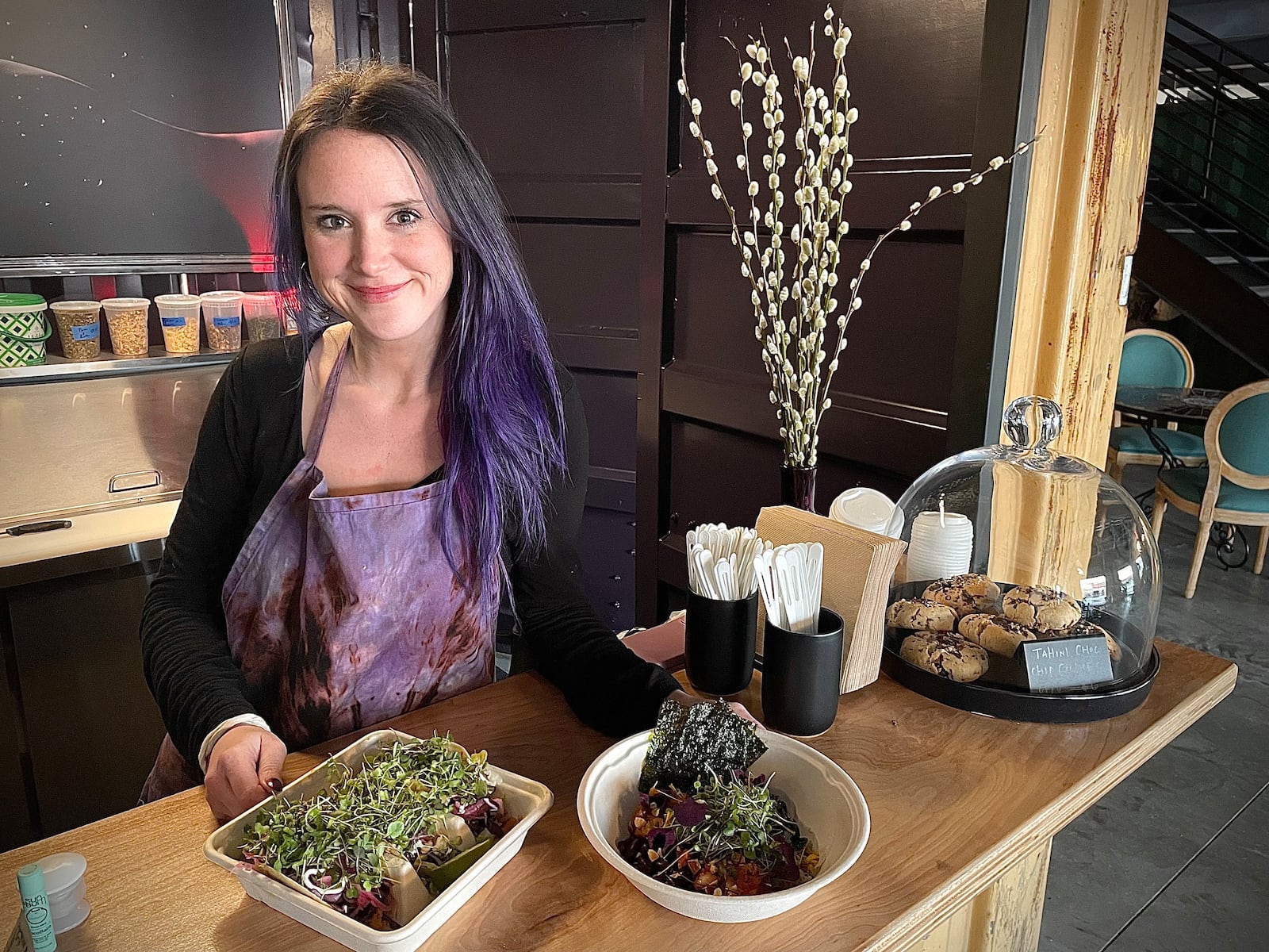 Indigo, a concept by Ordinarie Fare, features a variety of items including seasonal farm-to-table salads, grain bowls, West-Coast inspired burritos and a line of herbal “elixirs.” Pictured is owner Katie Mathews. NATALIE JONES/STAFF