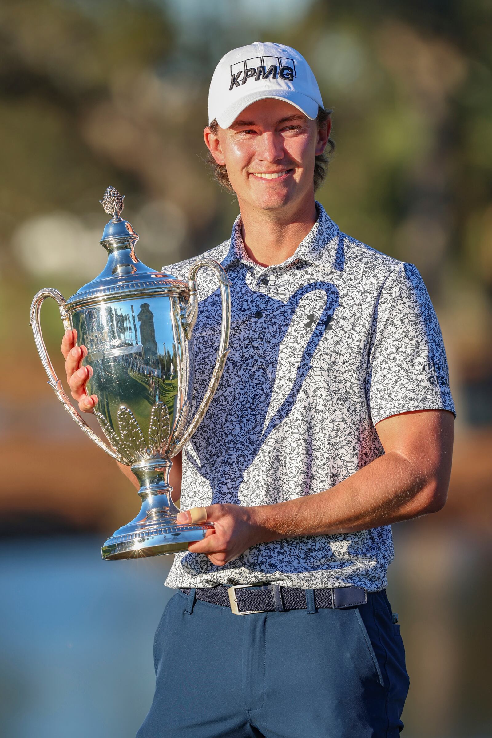 Maverick McNealy holds the trophy after the final round of the RSM Classic golf tournament, Sunday, Nov. 24, 2024, in St. Simons Island, Ga. (AP Photo/Gary McCullough)