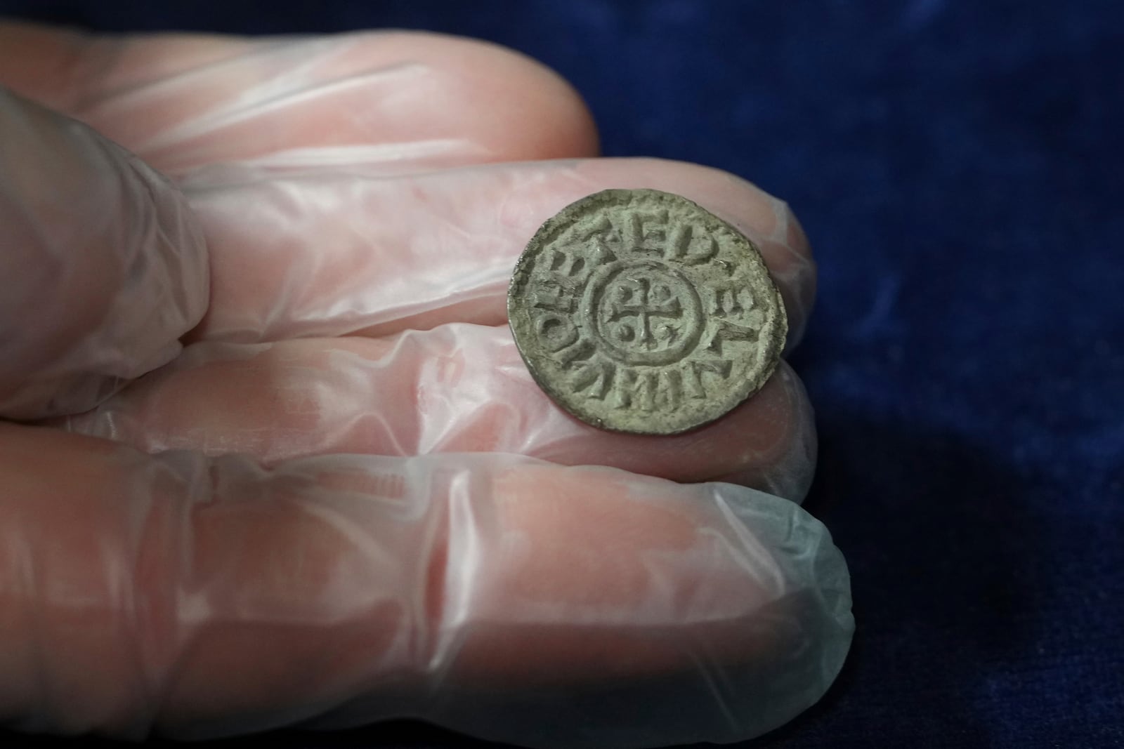 An early medieval silver penny of Guthrum of East Anglia, the first silver coin minted by a Viking ruler in Britain, is displayed at the British Museum's annual treasure launch in London, Tuesday, Feb. 11, 2025. (AP Photo/Kirsty Wigglesworth)