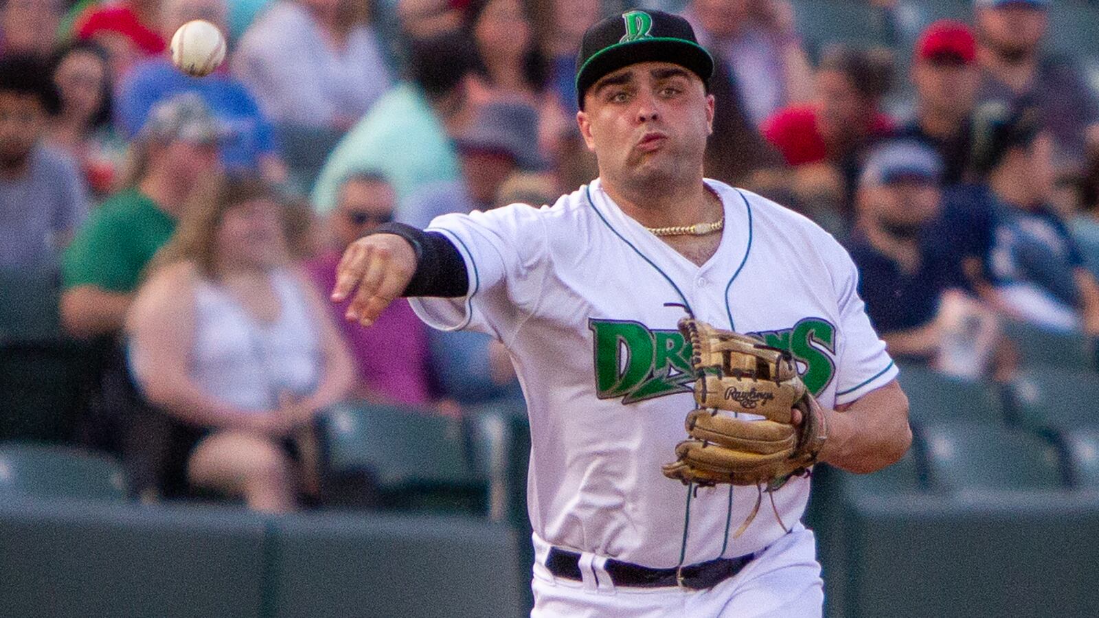 Dragons third baseman Sal Stewart throws out a runner at first during a game vs. Lansing last season at Day Air Ballpark. Jeff Gilbert/CONTRIBUTED