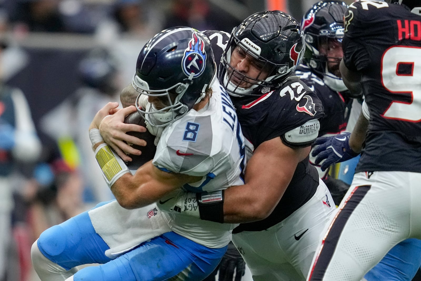 Houston Texans defensive tackle Tommy Togiai (72) sacks Tennessee Titans quarterback Will Levis (8) during the second half an NFL football game Sunday, Nov. 24, 2024, in Houston. (AP Photo/Ashley Landis)