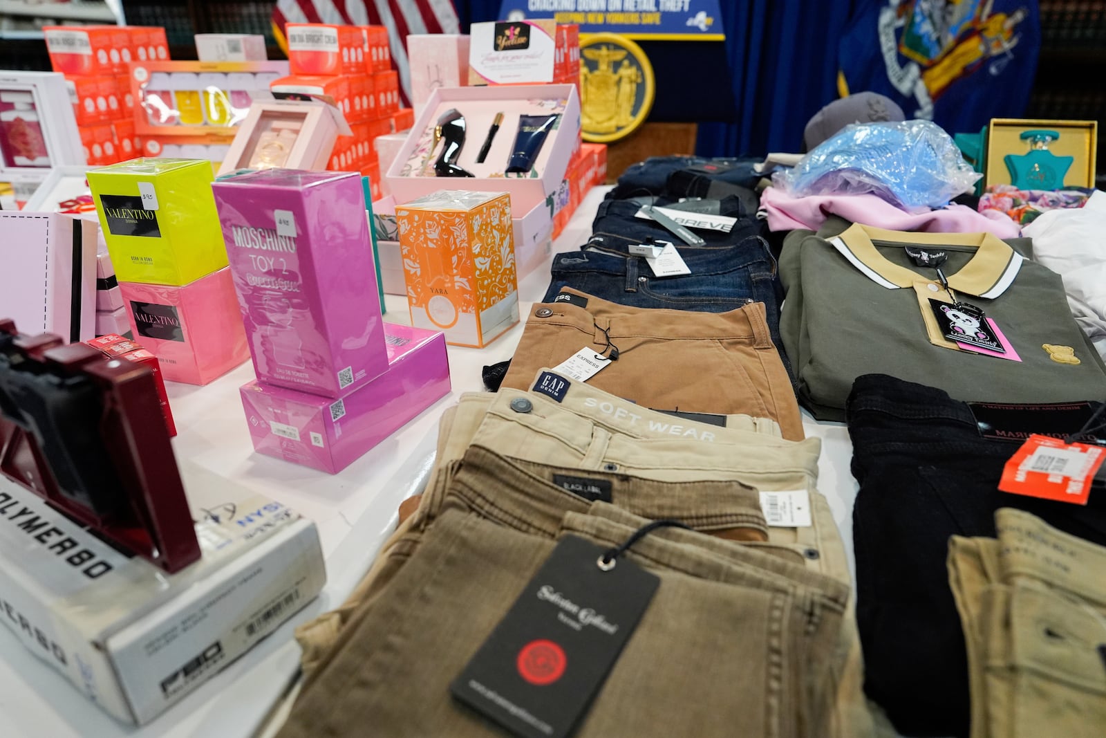 Stolen merchandise is displayed during a press conference on an international stolen merchandise ring, Tuesday, Nov. 26, 2024, in the Queens borough of New York. (AP Photo/Julia Demaree Nikhinson)