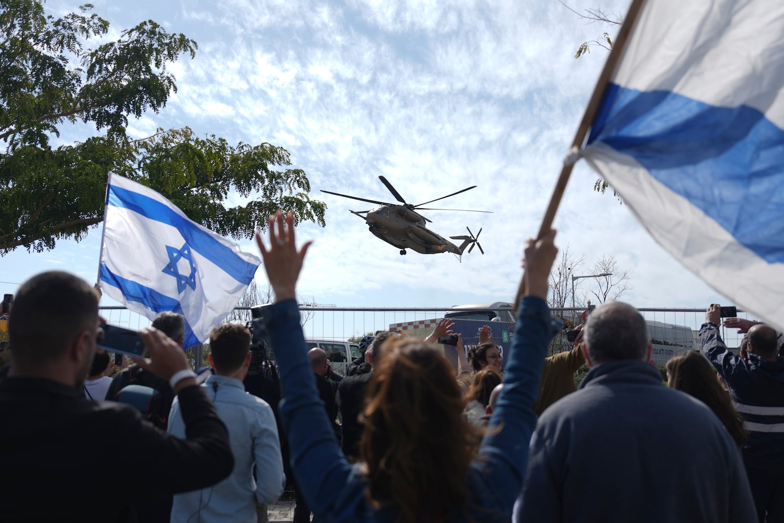 An Israeli military helicopter carrying two freed hostages from Hamas captivity in Gaza, American-Israeli Sagui Dekel Chen and Russian-Israeli Alexander (Sasha) Troufanov, arrives at the Sheba Hospital in Ramat Gan, Israel, Saturday, Feb. 15, 2025. (AP Photo/Ariel Schalit)