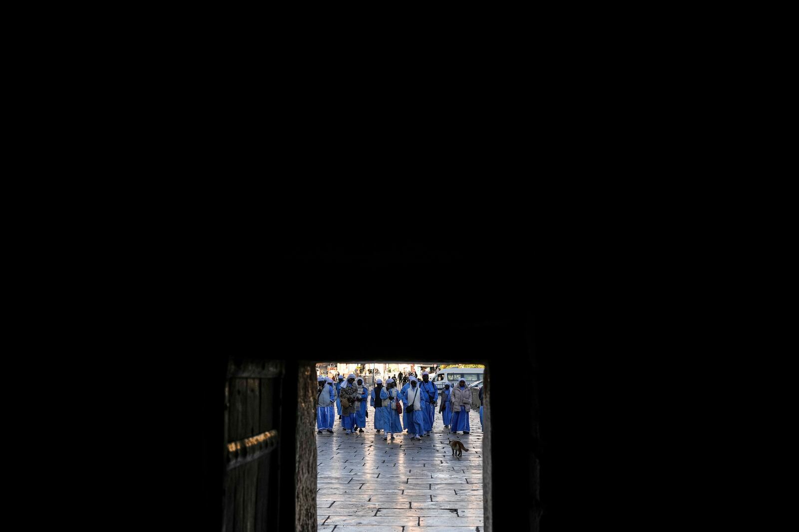 Nigerian worshippers walk along the Church of the Nativity, traditionally believed to be the birthplace of Jesus, on Christmas Eve, in the West Bank city of Bethlehem, Tuesday, Dec. 24, 2024. (AP Photo/Matias Delacroix)