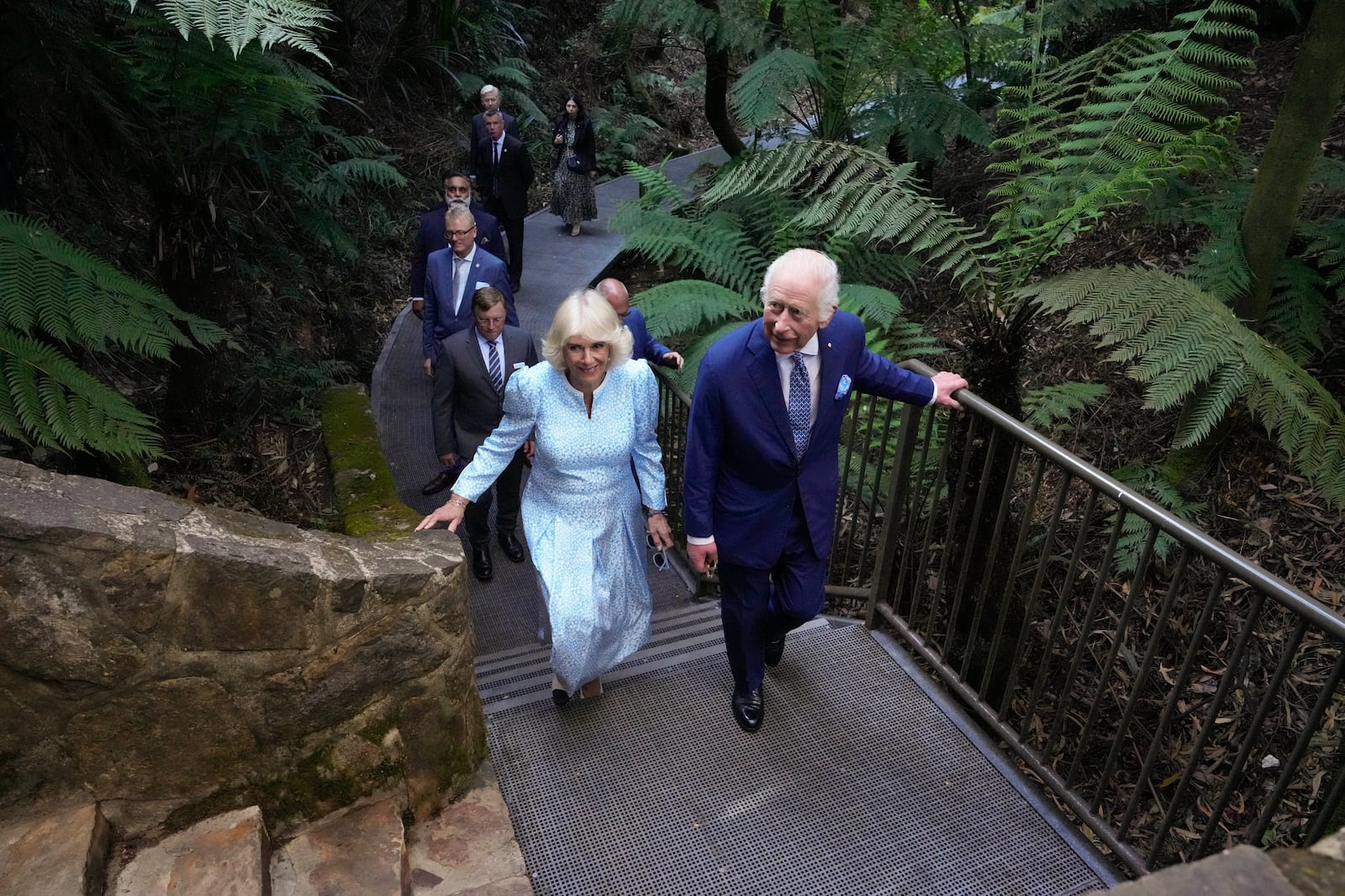 Britain's King Charles III, and Queen Camilla walk through the Rainforest Gully at the Australian National Botanic Gardens in Canberra, Monday, Oct. 21, 2024. (AP Photo/Mark Baker, Pool)