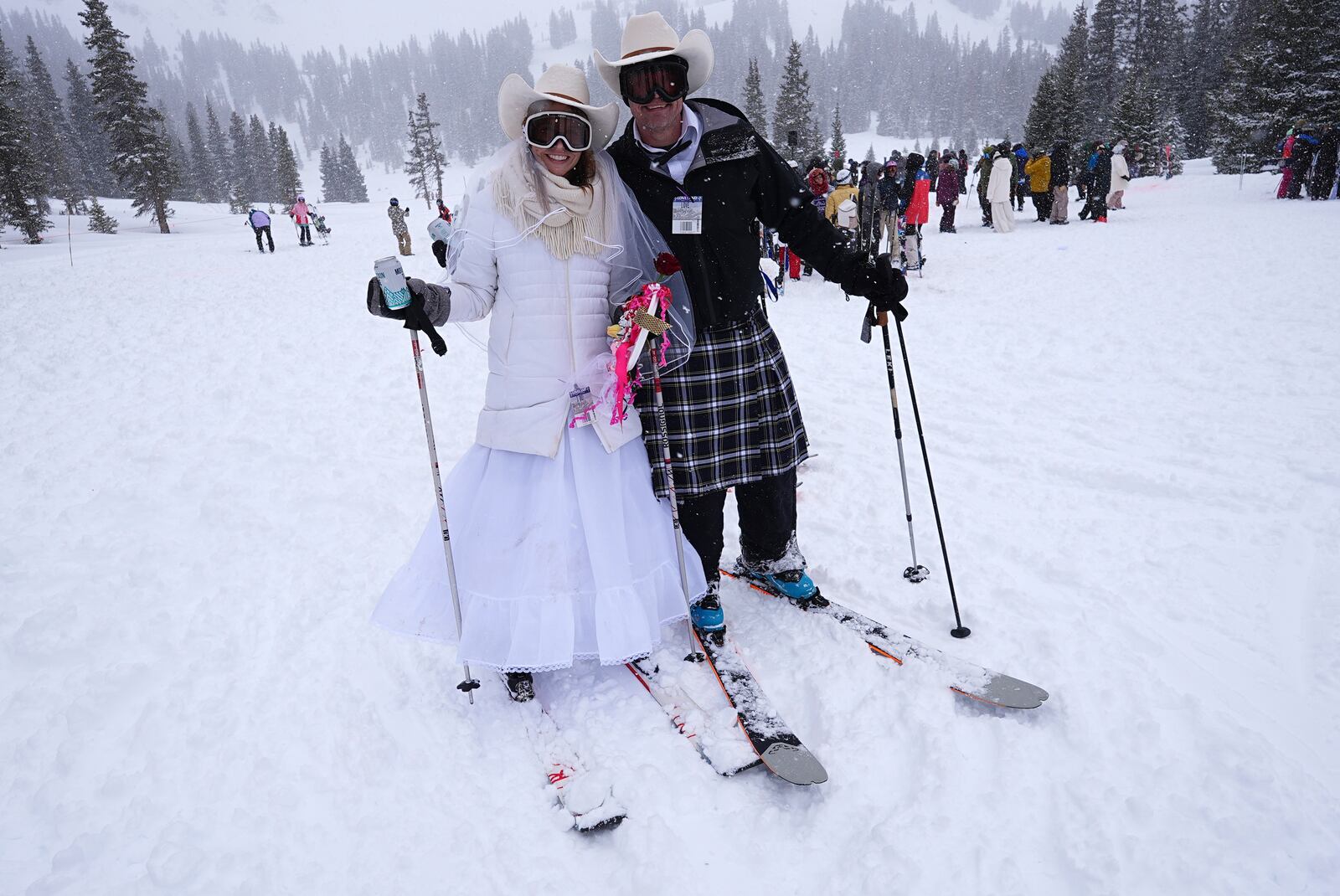 Sami and Mike Matson of Superior, Colo., renew their wedding vows for the third time during the 35th annual Marry Me & Ski for Free Valentine's Day mountaintop matrimony ceremony Friday, Feb. 14, 2025, at Loveland Ski Area, Colo. (AP Photo/David Zalubowski)