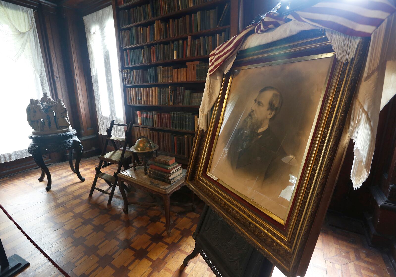 A framed portrait of Donn Piatt sits in the library of Mac-O-Chee the home he built in West Liberty. Donn Piatt and his brother Abram built a pair of homes in Logal County called the Piatt Castles. LISA POWELL / STAFF