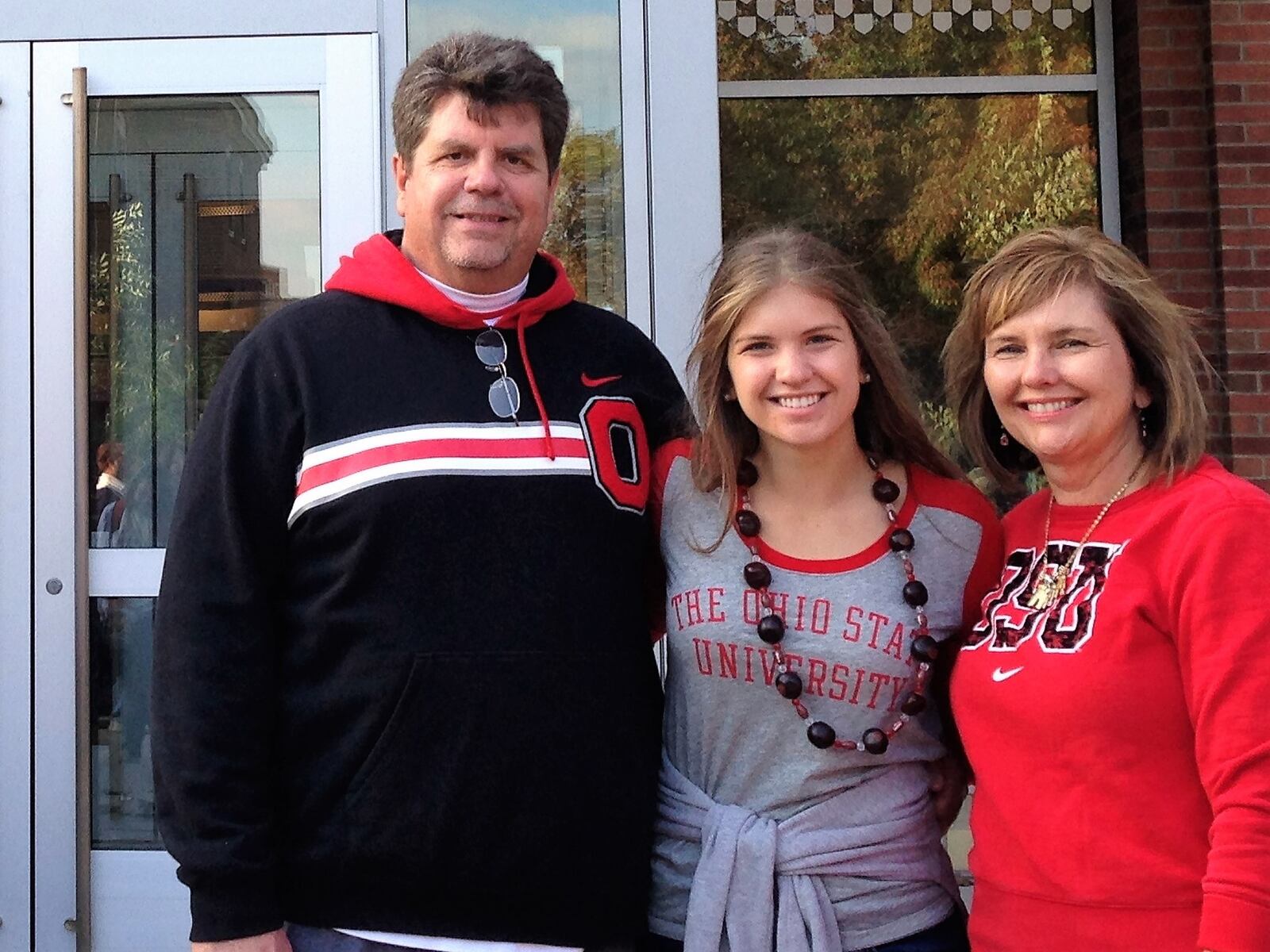 Julie Domicone (center) with her parents, Fred and Stacey Domicone.