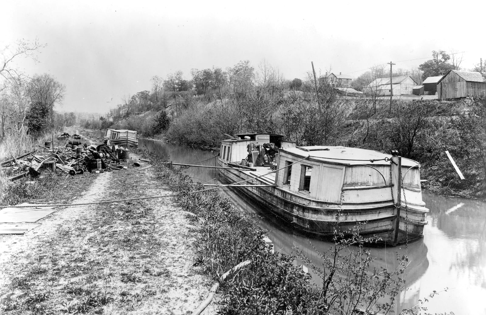 Two canal boats travel north on the Miami and Erie Canal north of Miamisburg. DAYTON METRO LIBRARY / MONTGOMERY COUNTY PICTURE FILE