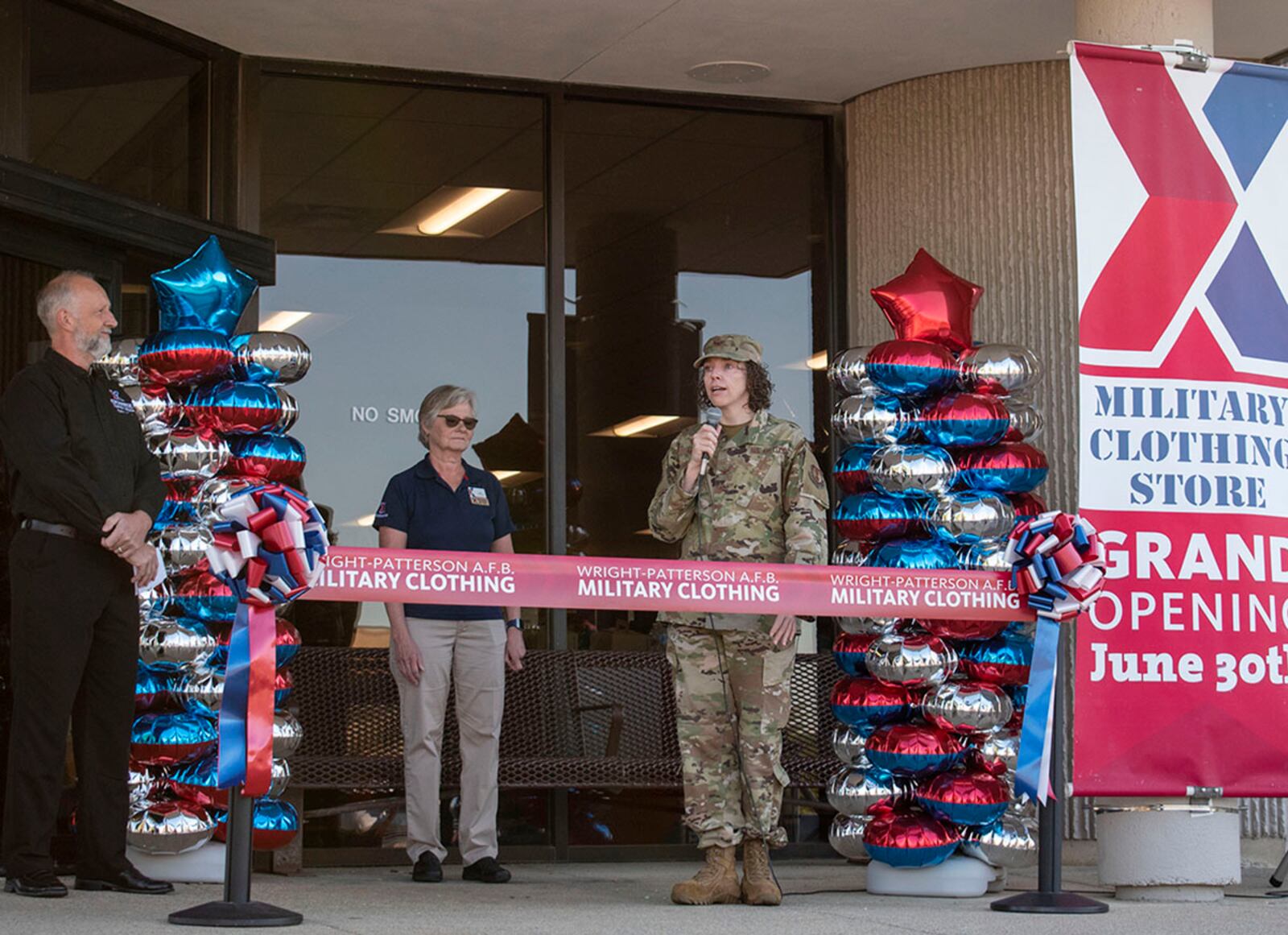 Col. Sirena Morris, 88th Mission Support Group commander, provides remarks during a reopening ceremony June 30 for Military Clothing Sales at Wright-Patterson Air Force Base. U.S. AIR FORCE PHOTO/STAFF SGT. MIKALEY KLINE