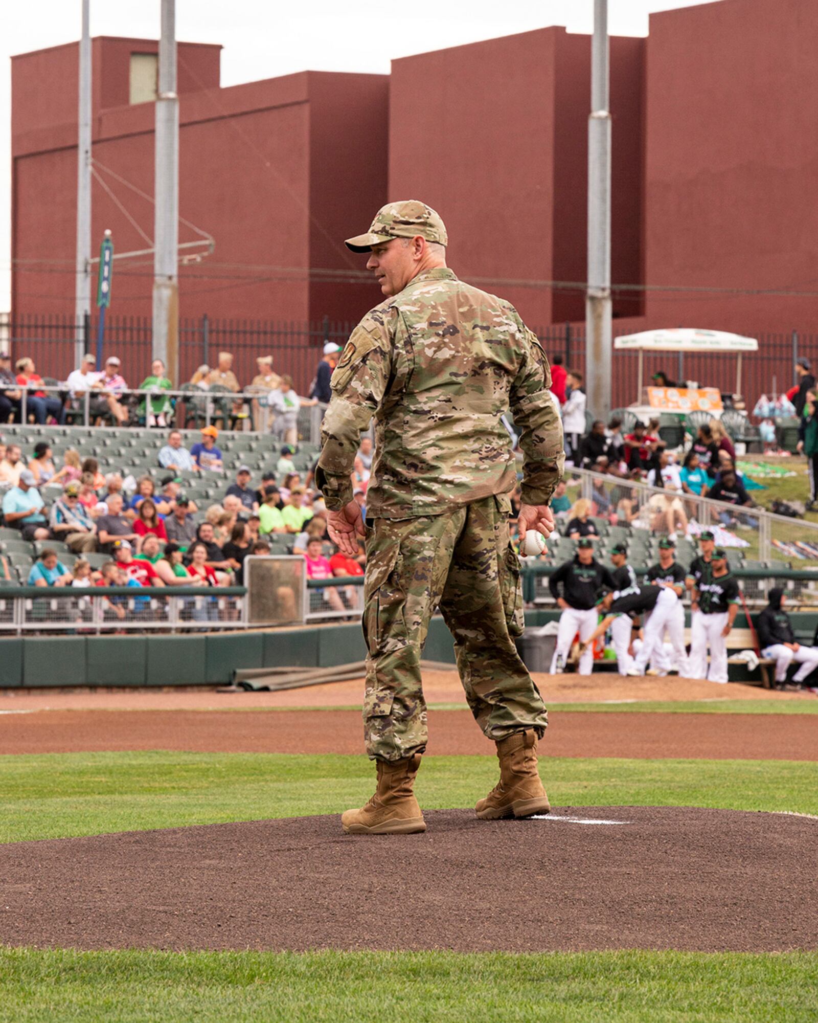 Col. Christopher Meeker, 88th Air Base Wing and Wright-Patterson Air Force Base commander, prepares to throw a ceremonial first pitch before the Dayton Dragons game Aug. 13 as part of American Celebration night at Day Air Ballpark. U.S. AIR FORCE PHOTO/JAIMA FOGG