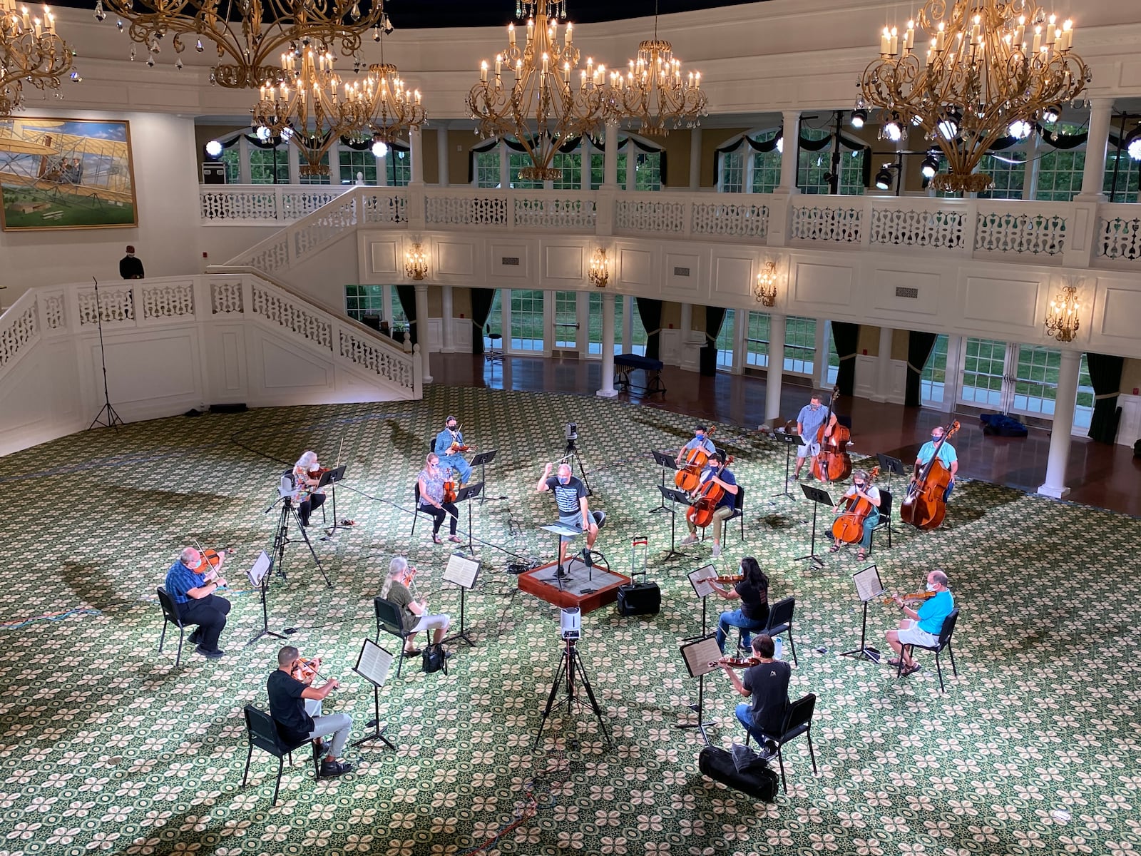 Musicians of the Dayton Philharmonic under the direction of Artistic Director and Conductor Neal Gittleman rehearse in the Grand Ballroom at Carillon Historical Park for an upcoming virtual concert. CONTRIBUTED