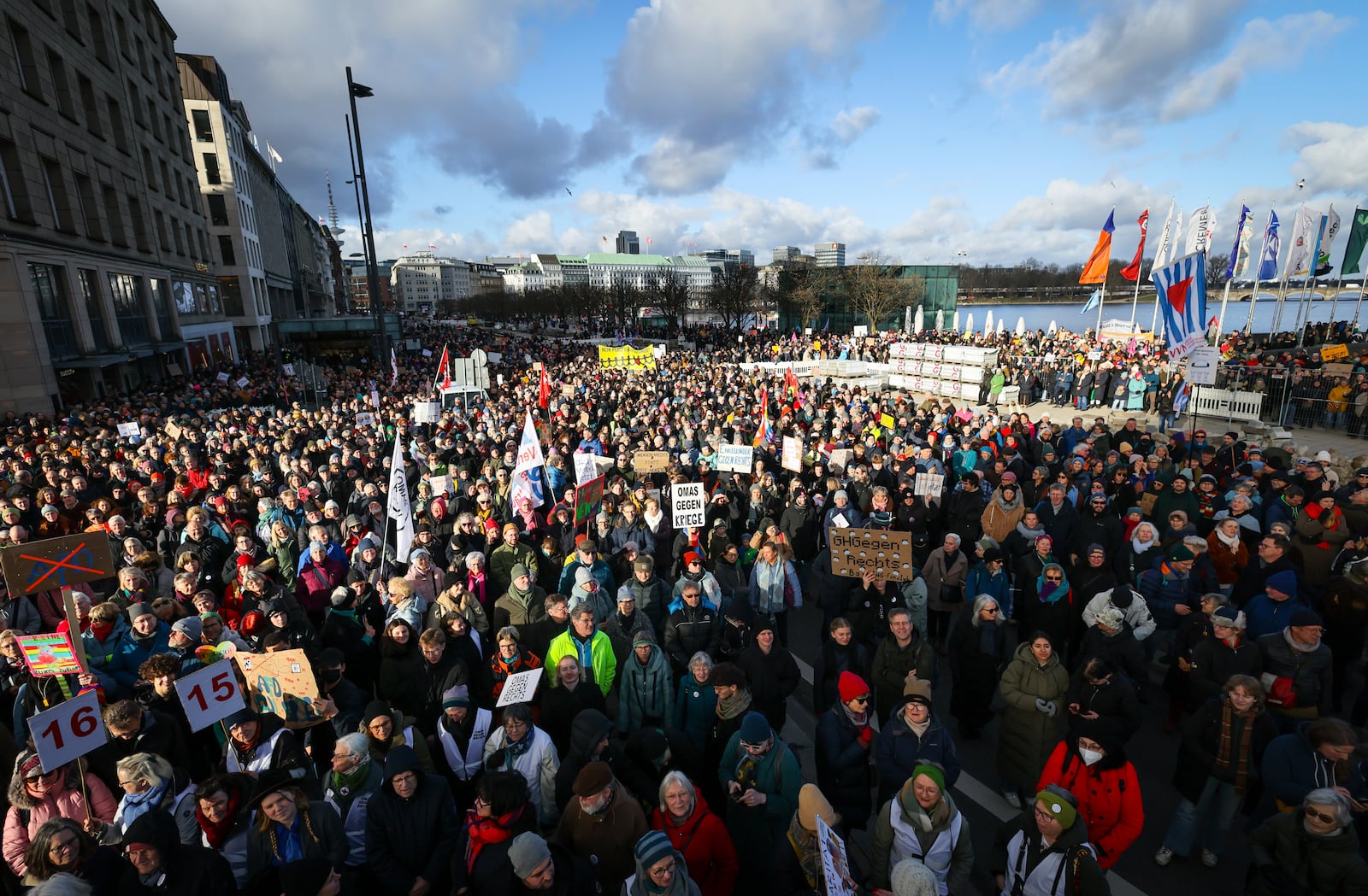 Participants in a protest under the slogan "Human chain against the AfD and its anti-human policies" demonstrate in the city center, in Hamburg, Friday, Jan. 31, 2025, the day after with the support of the AfD, the Bundestag approved a CDU/CSU motion to reject asylum seekers at Germany's borders. (Christian Charisius/dpa via AP)