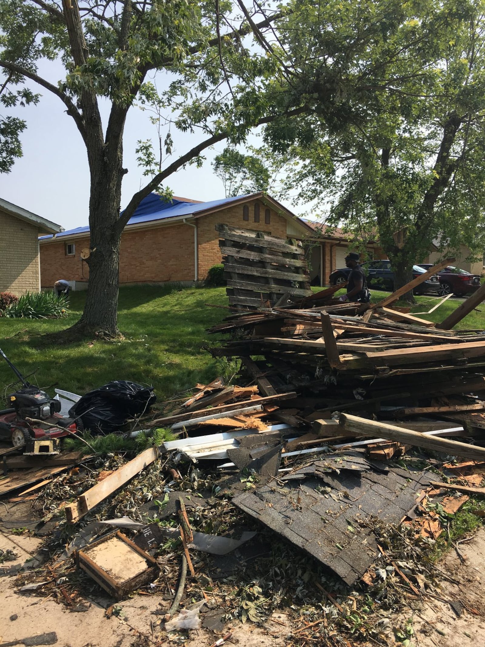 Volunteers and residents fanned out in tornado-ravaged Trotwood neighborhoods on Saturday to help clean-up debris and trees. PHOTO by Lynn Hulsey