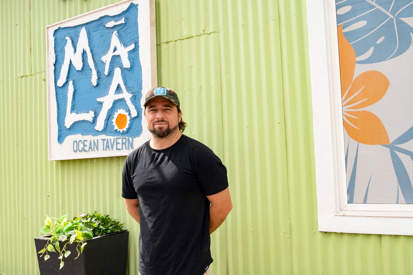 Javier Barberi, one of the owners of Mala Ocean Tavern, Coco Deck, and Pizza Paradiso, poses for a picture at Mala Ocean Tavern, Monday, Nov. 18, 2024, in Lahaina, Hawaii. Barberi looks forward to the Maui Invitational, where Pizza Paradiso will be one of the food vendors. (AP Photo/Mengshin Lin)