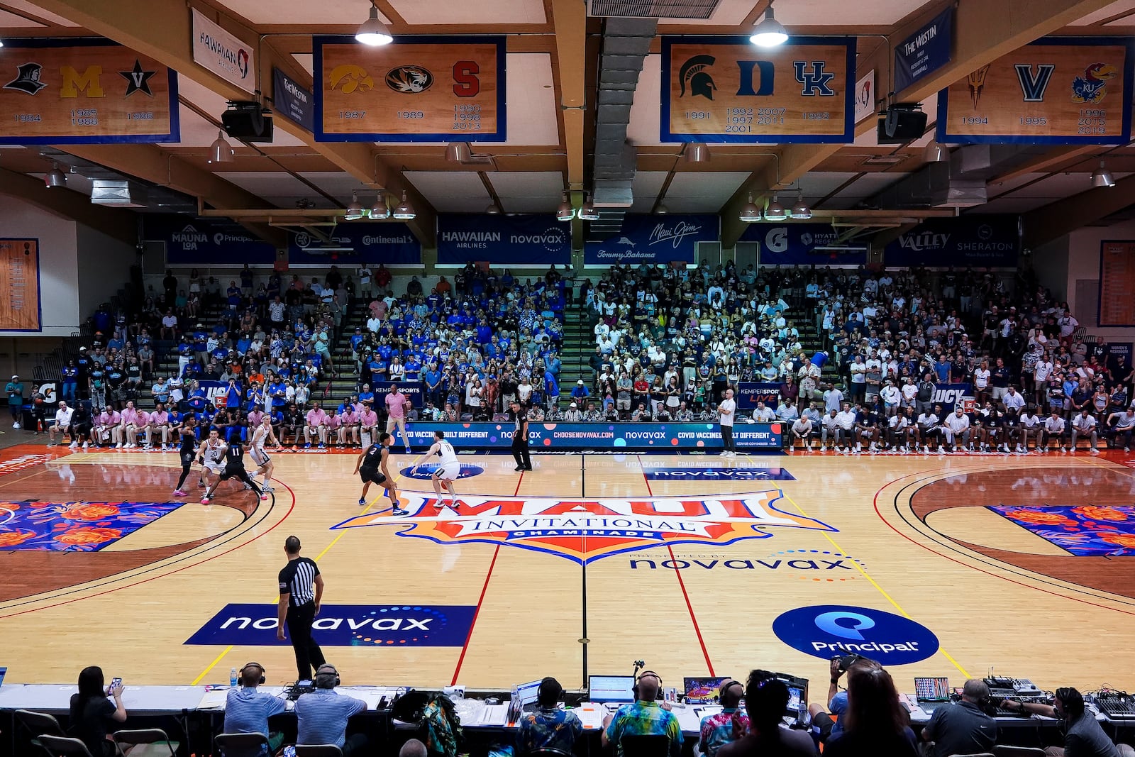 UConn forward Alex Karaban moves the ball against Memphis forward Nicholas Jourdain during the first half of an NCAA college basketball game at the Maui Invitational Monday, Nov. 25, 2024, in Lahaina, Hawaii. (AP Photo/Lindsey Wasson)